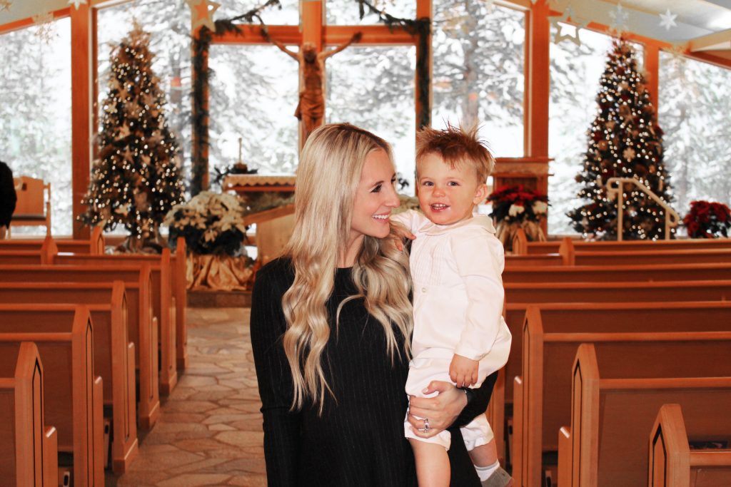 Emily Farren Wieczorek of Two Peas in a Prada and her son at her son's baptism