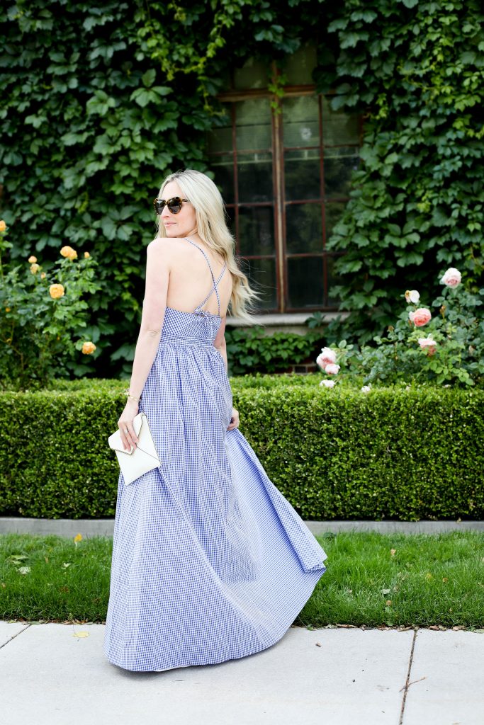 Emily Farren Wieczorek of Two Peas in a Prada wears a blue J Crew gingham maxi dress for the Fourth of July. 