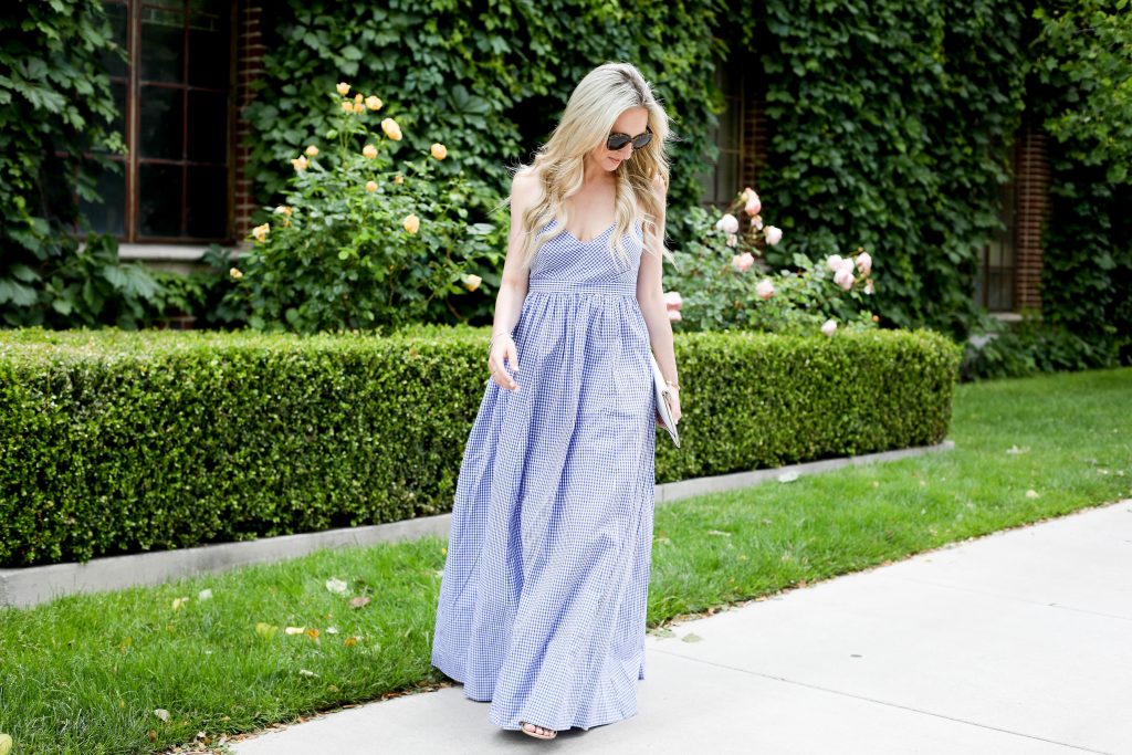 Emily Farren Wieczorek of Two Peas in a Prada wears a blue J Crew gingham maxi dress for the Fourth of July. 