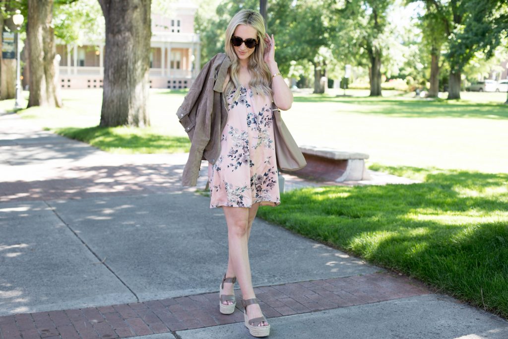 Emily Farren Wieczorek of Two Peas in a Prada wears a BLANK NYC suede moto jacket and a floral slip dress, and talks about transitioning your summer dresses into fall. 