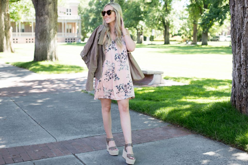 Emily Farren Wieczorek of Two Peas in a Prada wears a BLANK NYC suede moto jacket and a floral slip dress, and talks about transitioning your summer dresses into fall. 