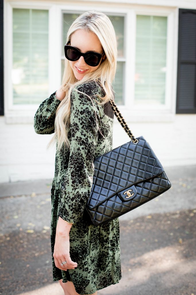 Emily Farren Wieczorek of Two Peas in a Prada styles an Army Green Floral dress for fall - it's under $100 and it will take you from season to season. 