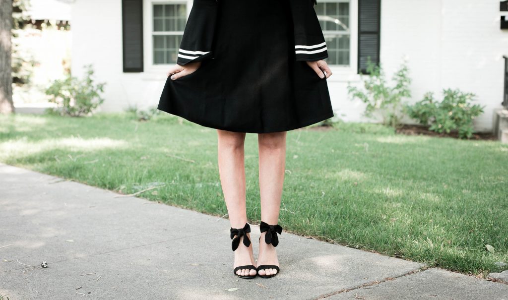 Emily Farren Wieczorek of Two Peas in a Prada wears classic bow pumps from Avec les Filles in sponsorship with Zappos.