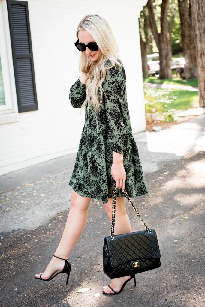 Emily Farren Wieczorek of Two Peas in a Prada styles an Army Green Floral dress for fall - it's under $100 and it will take you from season to season. 