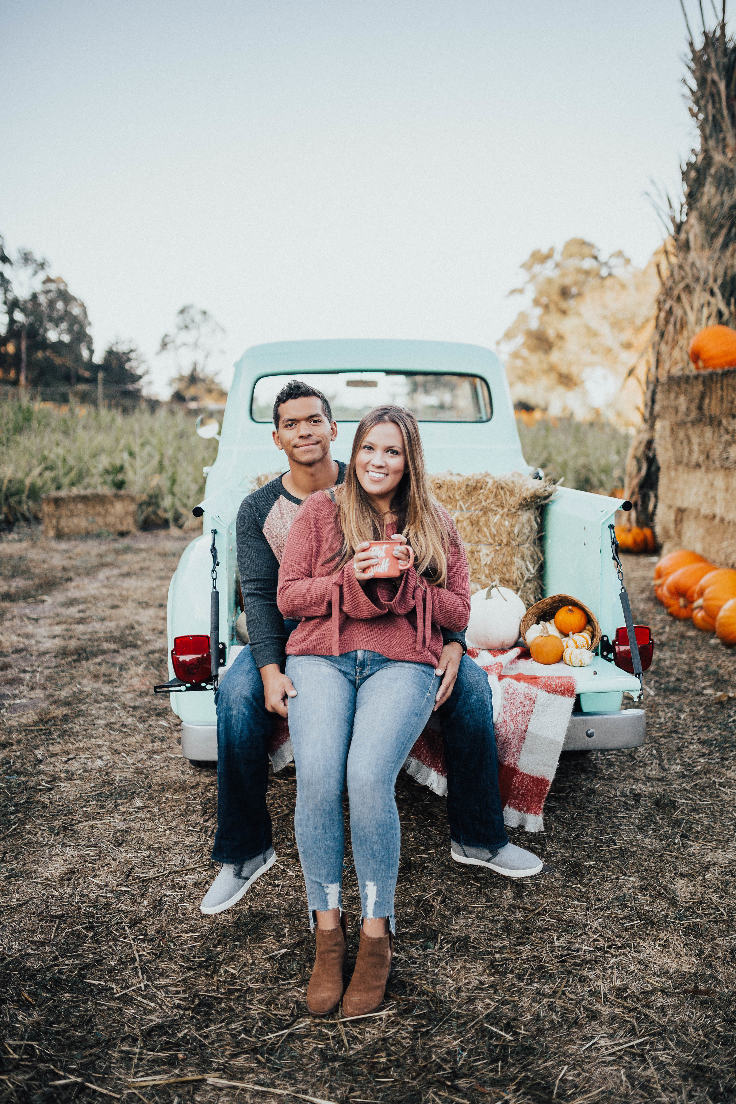 Ashley Zeal from Two Peas in a Prada shares her trip to Arata's Pumpkin farm in Half Moon Bay California. She is wearing a sweater from Express. 