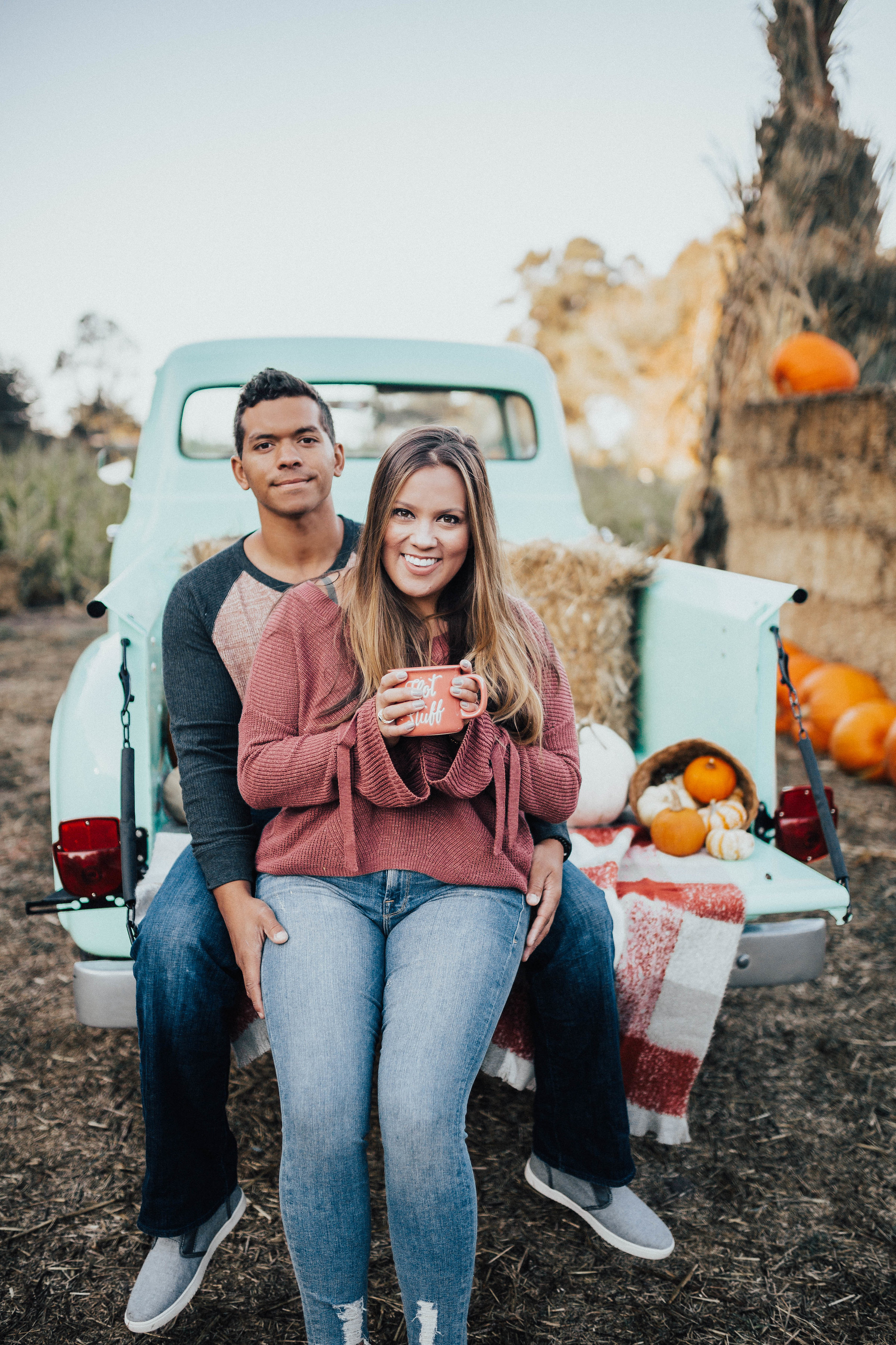 Ashley Zeal from Two Peas in a Prada shares her trip to Arata's Pumpkin farm in Half Moon Bay California. She is wearing a sweater from Express. 