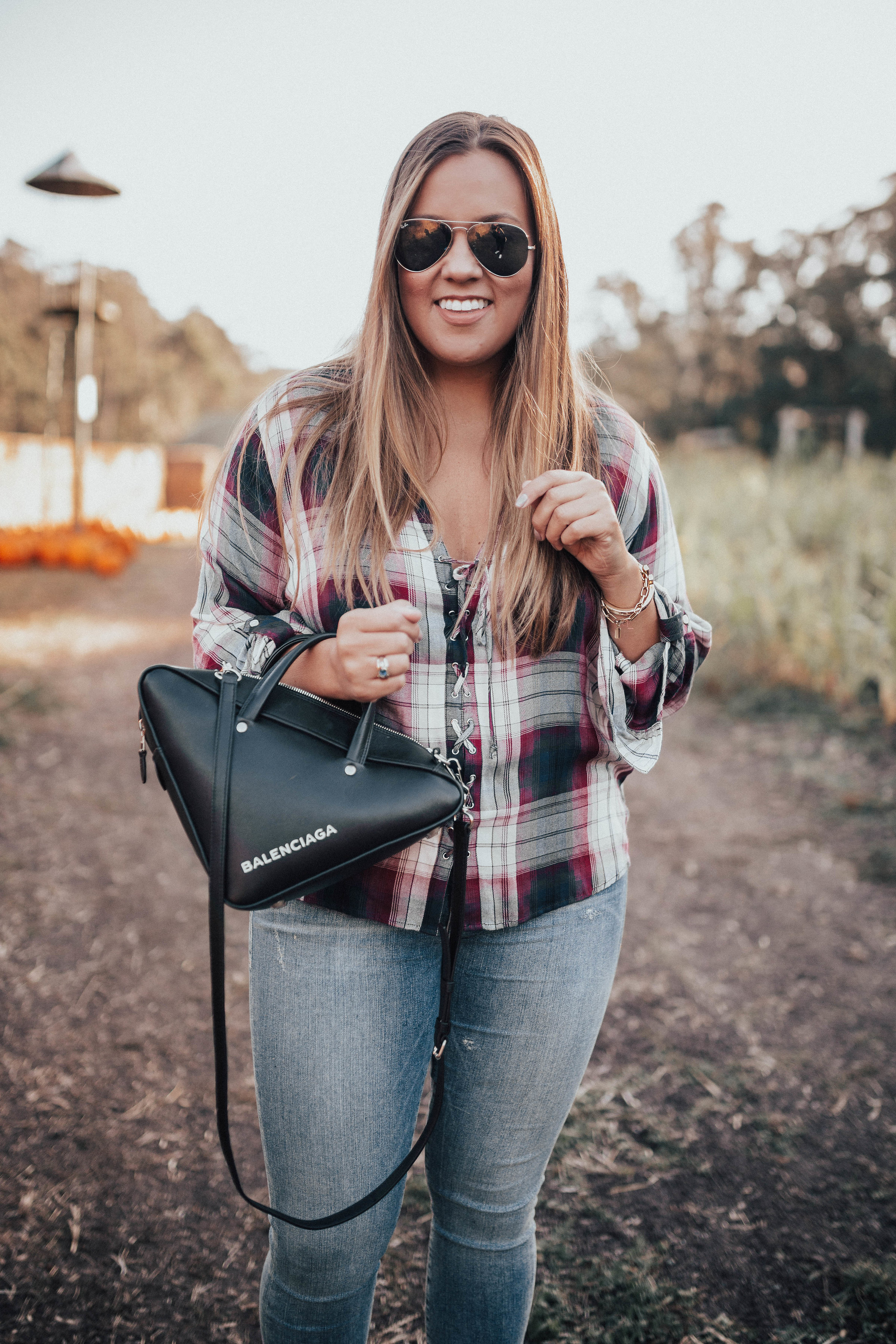 Ashley Zeal from Two Peas in a Prada shares a plaid lace up top from Express. She also discusses the end of October and what's coming up on Two Peas. 