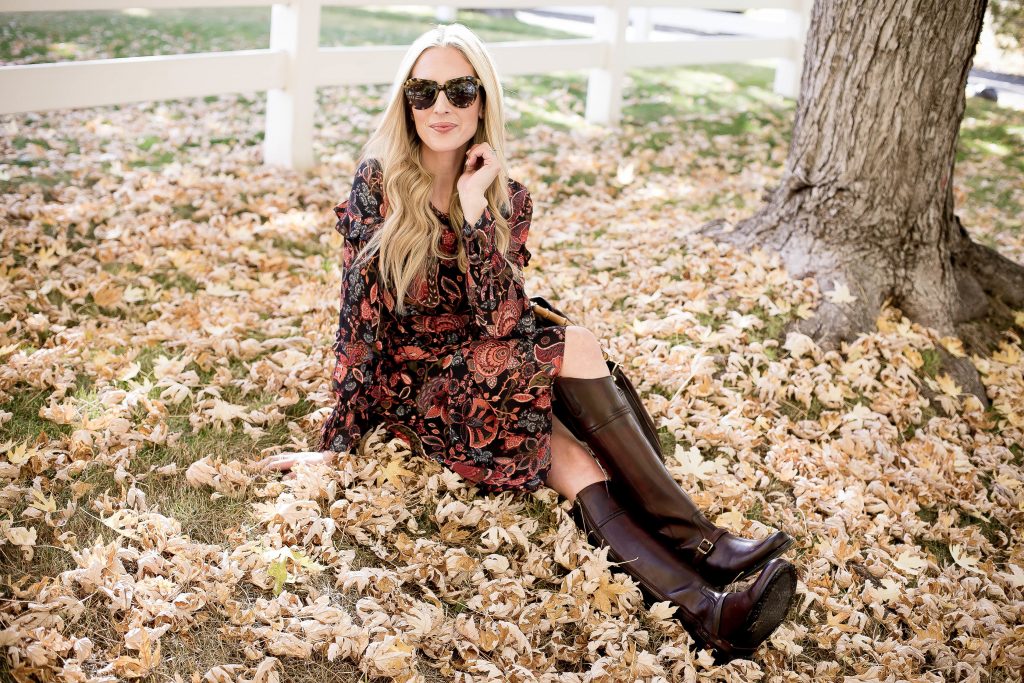 Emily Farren Wieczorek of Two Peas in a Prada wears a floral dress and knee high riding boots by Two24 by Ariat from Zappos.