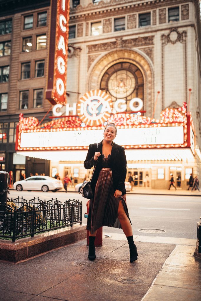 Ashley Zeal from Two Peas in a Prada shares a holiday sparkle outfit at the Chicago Theatre. 