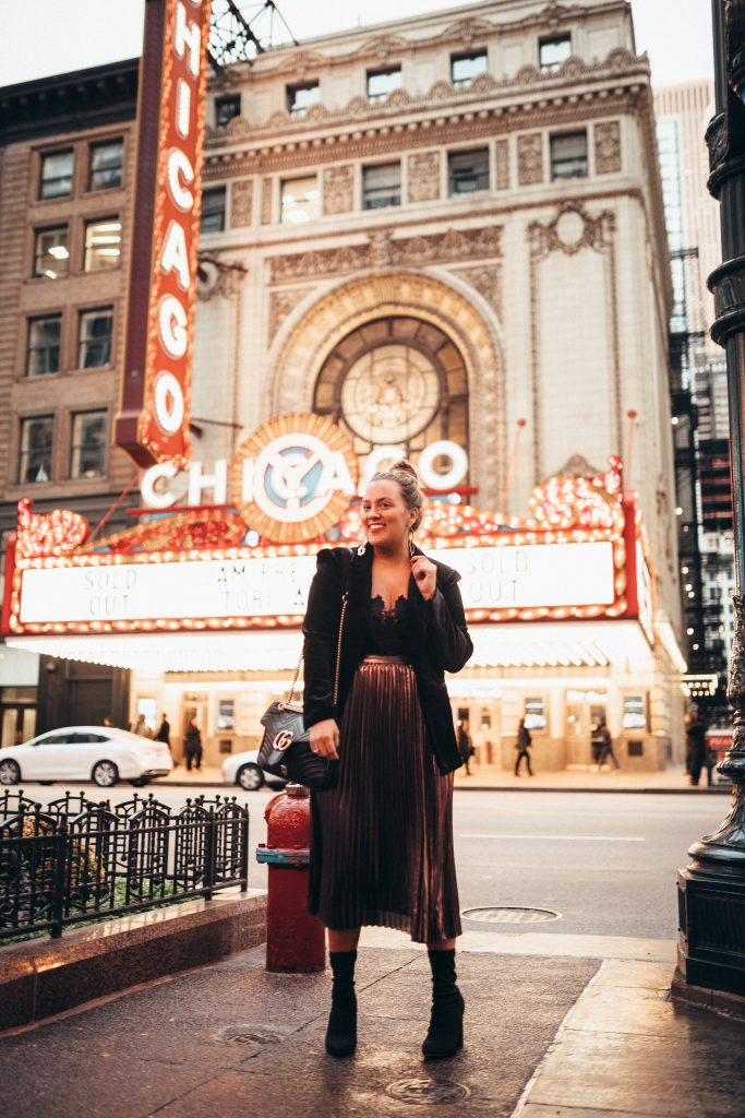 Ashley Zeal from Two Peas in a Prada shares a holiday sparkle outfit at the Chicago Theatre. 