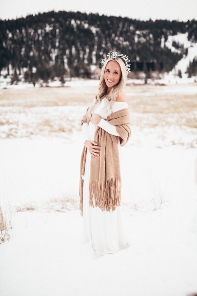 Emily Farren Wieczorek of Two Peas in a Prada wears a long sleeved white maxi dress and a flower crown by Petal To The Metal Reno. Birth announcement and gender reveal photos taken in Squaw Valley.