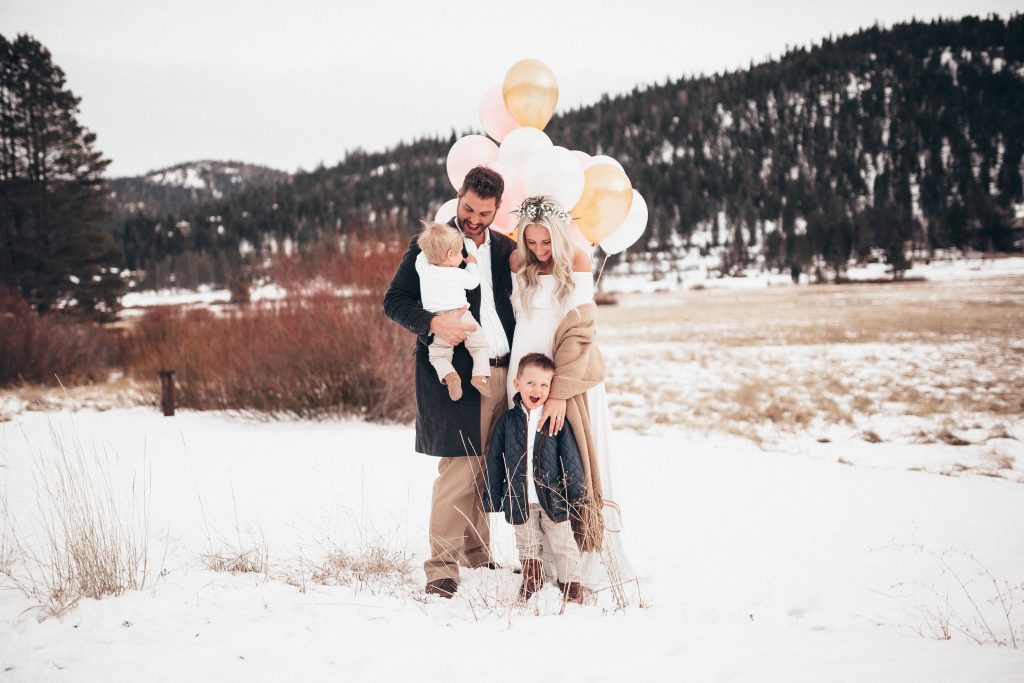 Emily Farren Wieczorek of Two Peas in a Prada wears a long sleeved white maxi dress and a flower crown by Petal To The Metal Reno. Birth announcement and gender reveal photos taken in Squaw Valley.