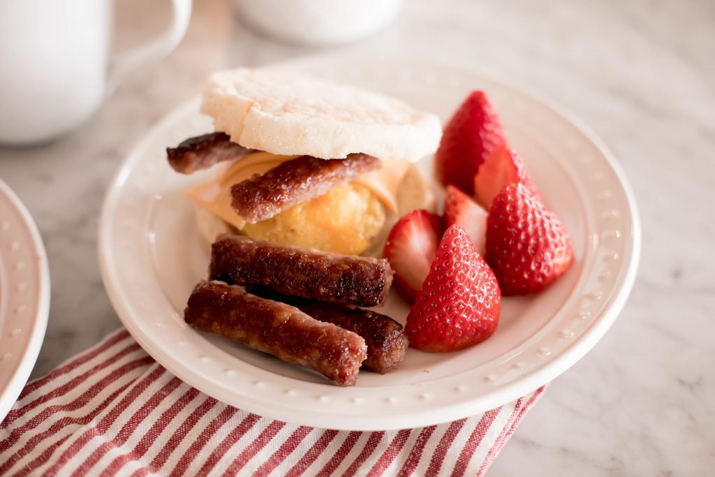 Emily Farren Wieczorek of Two Peas in a Prada shares her easy, make ahead breakfast sammie recipe made with Farmer John All Natural Bacon and All Natural Sausage.
