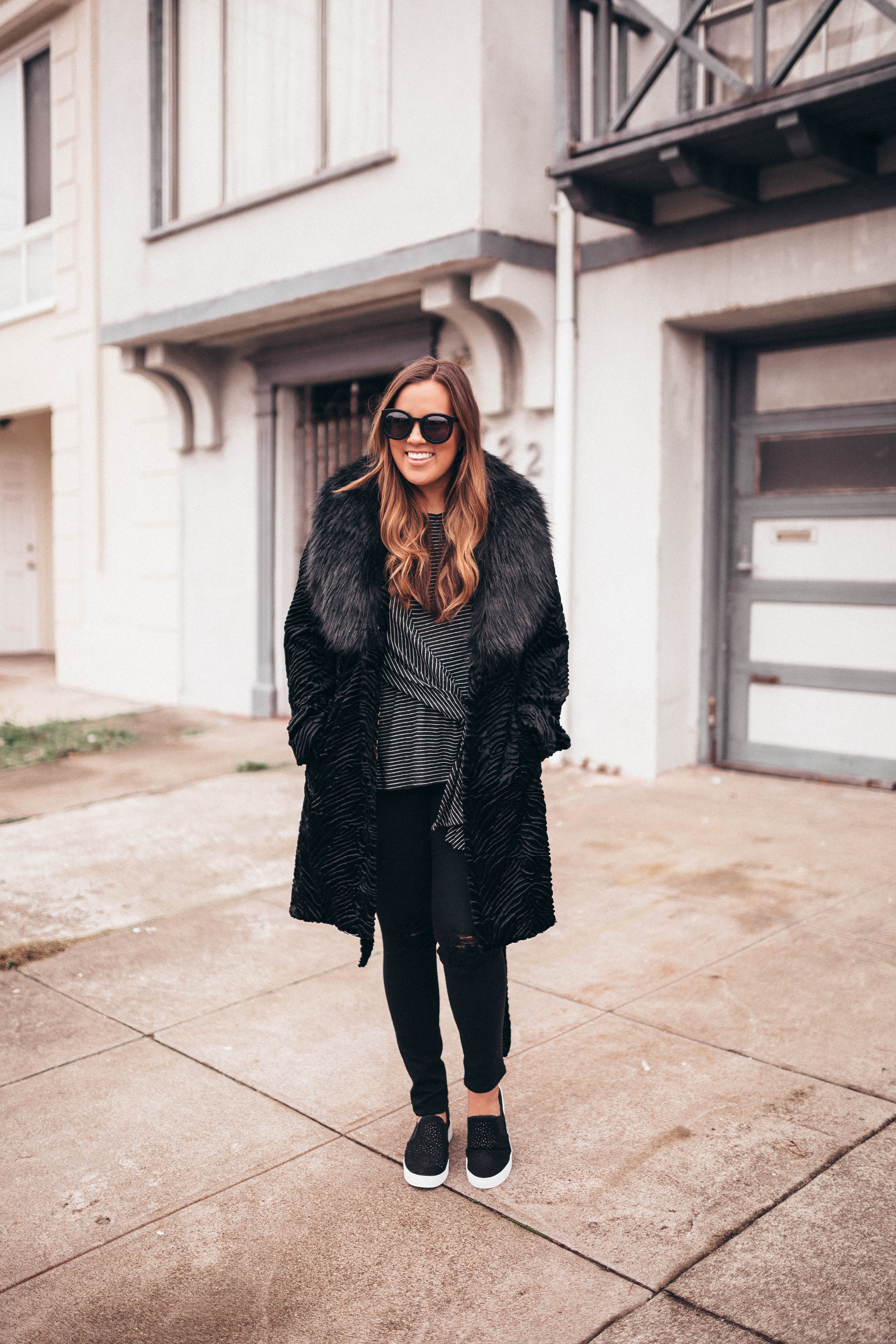 Ashley Zeal from Two Peas in a Prada shares a head to toe all black outfit. 