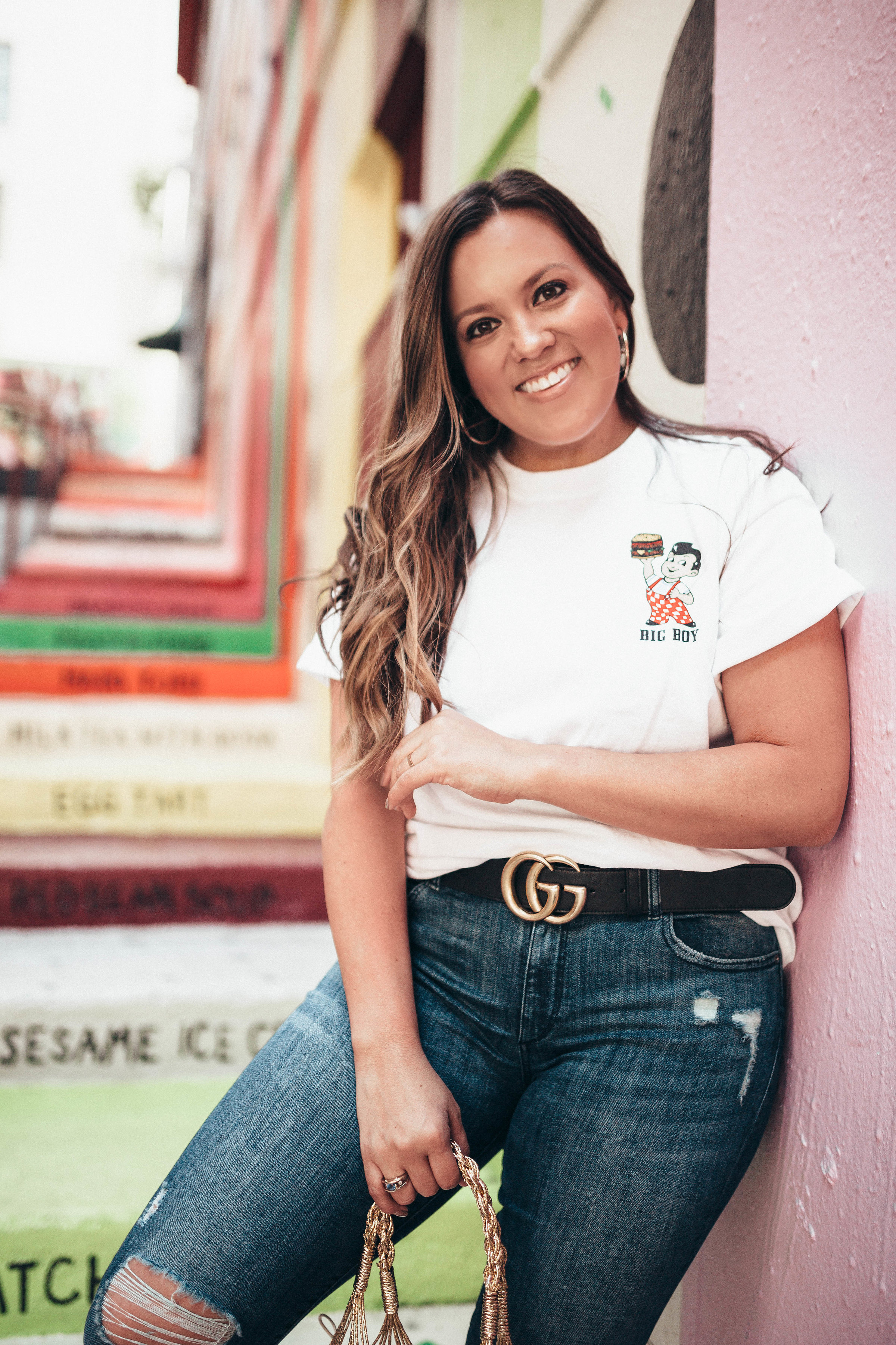 Ashley Zeal from Two Peas in a Prada shares the exact location of these colorful stairs in Chinatown. She is wearing a Bob's Big Boy graphic tee. 
