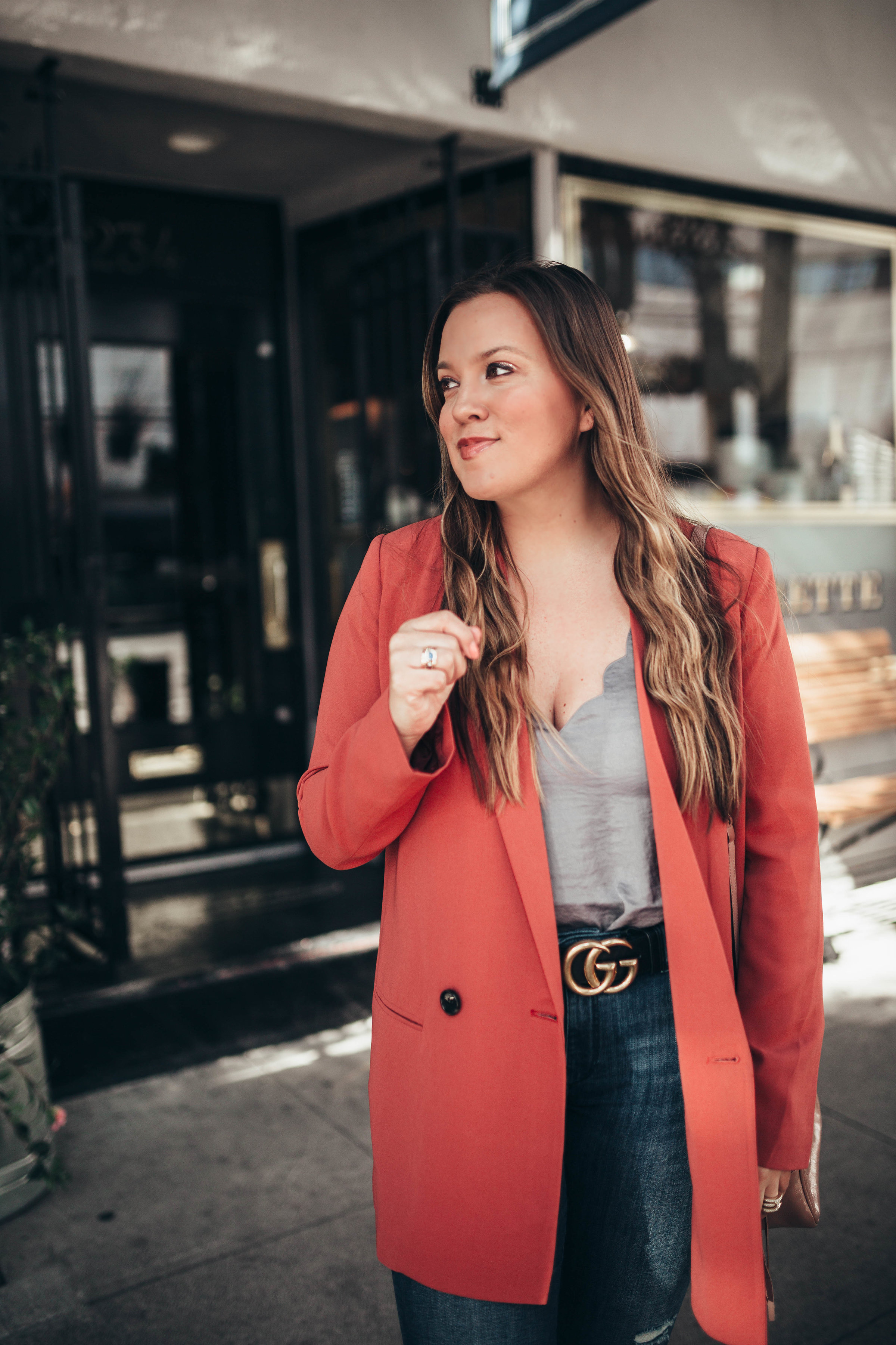 Ashley Zeal from Two Peas in a Prada shares the perfect rust blazer for spring. She is wearing a Topshop cami, Gucci belt and DL1961 jeans. 