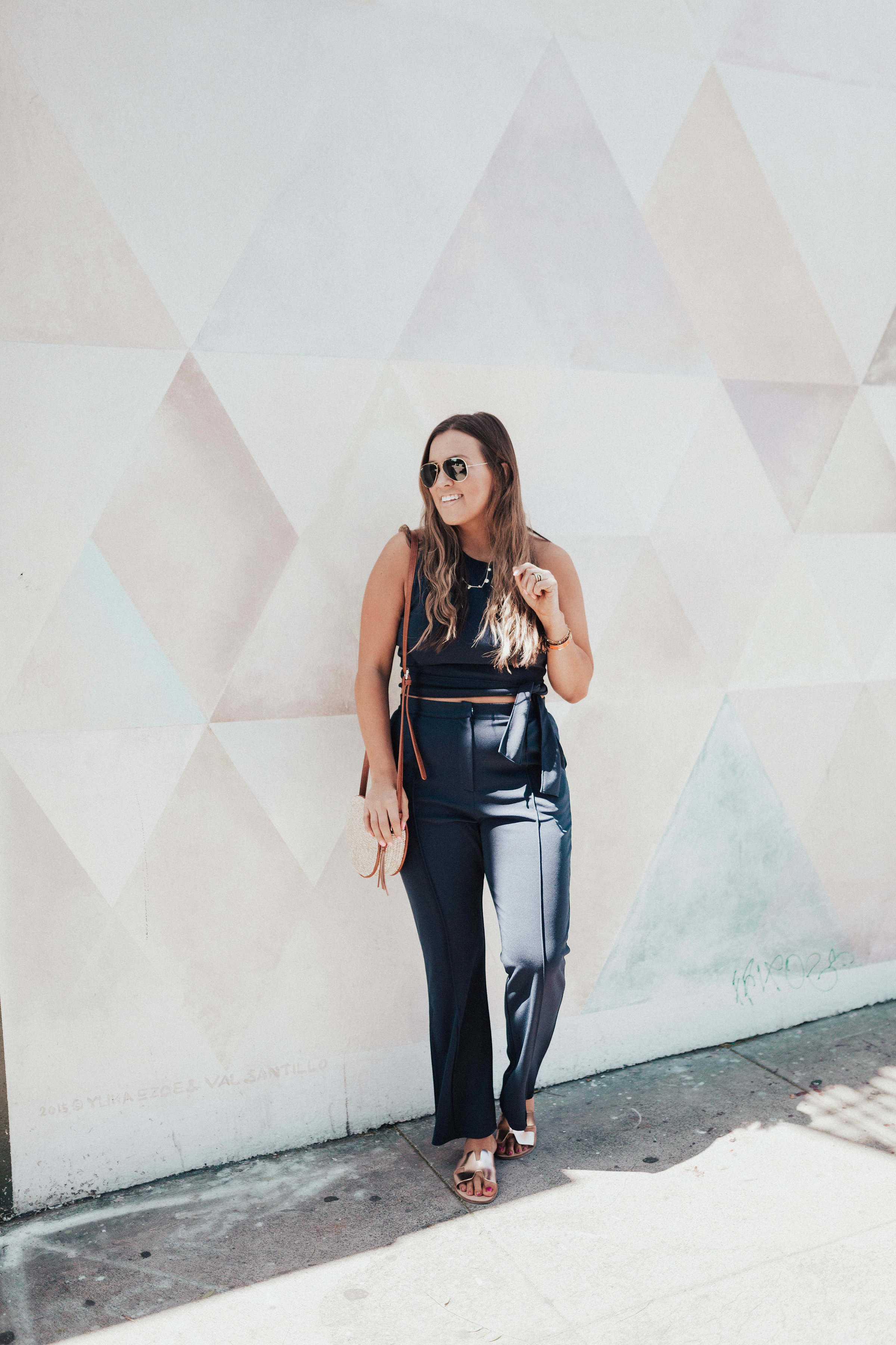Ashley Zeal from Two Peas in a Prada shares her favorite two piece sets for spring. She is wearing a Leith crop top and high waisted pants set. 