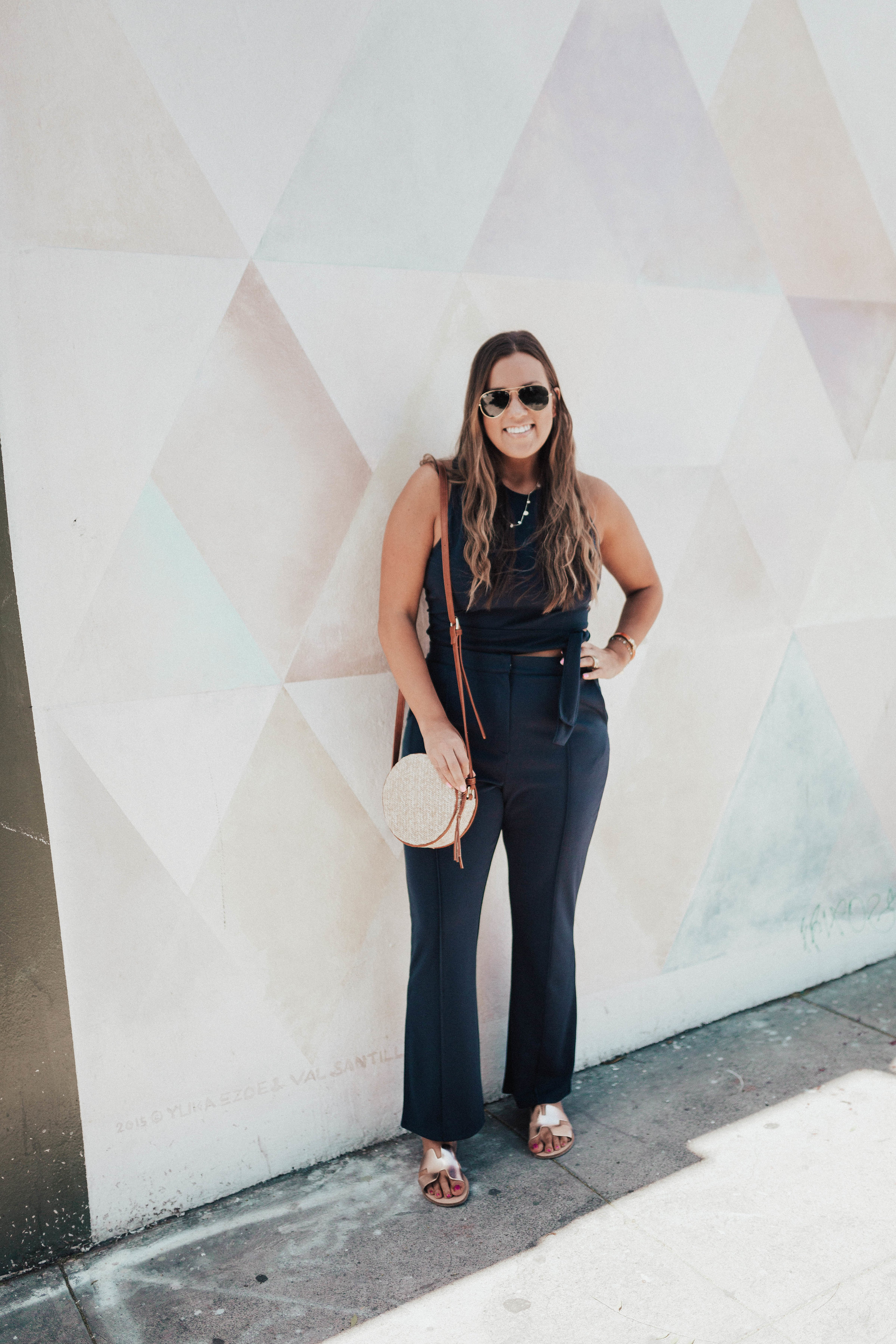 Ashley Zeal from Two Peas in a Prada shares her favorite two piece sets for spring. She is wearing a Leith crop top and high waisted pants set. 