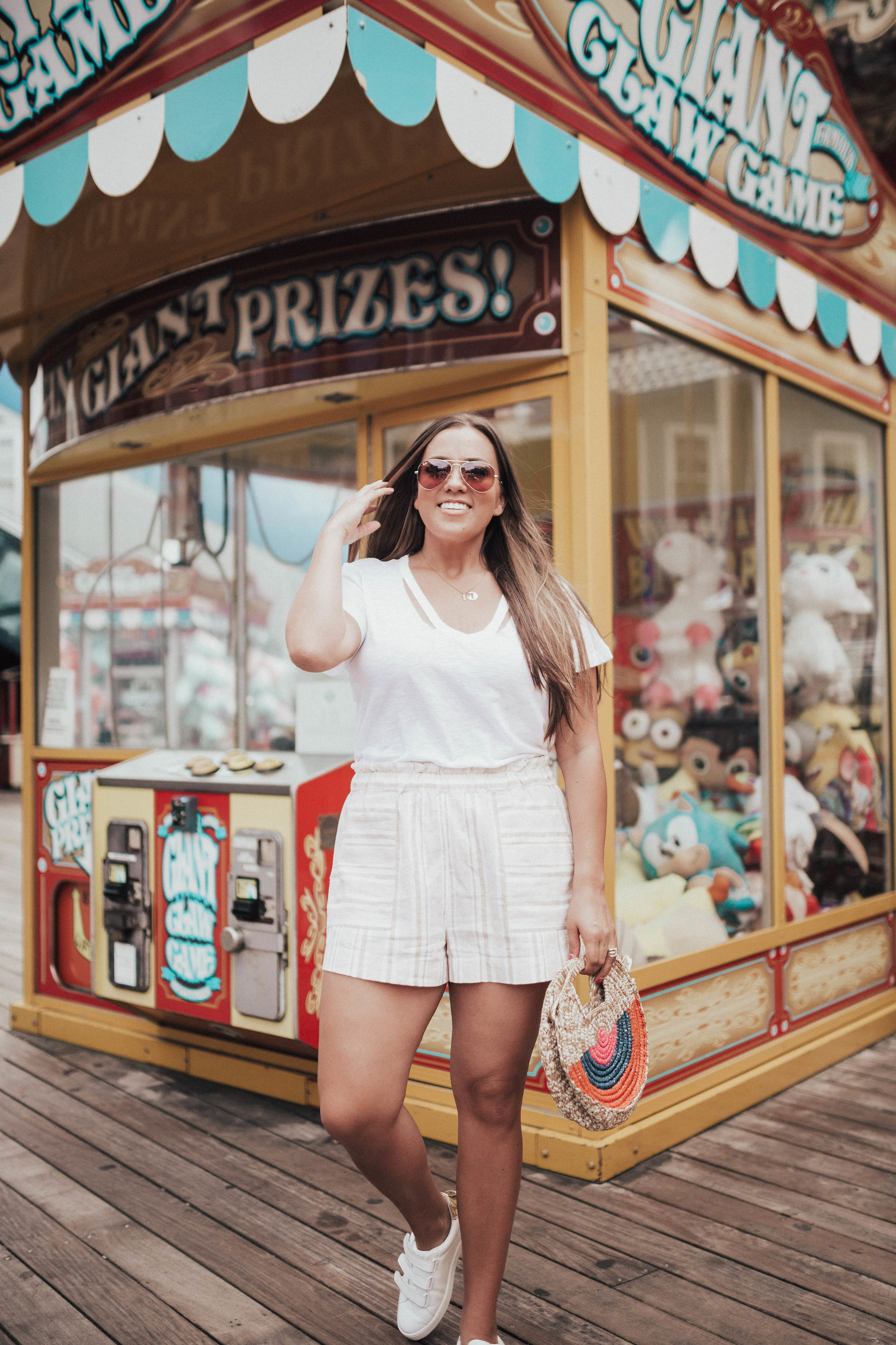 Ashley Zeal from Two Peas in a Prada shares her favorite summer shorts that aren't denim. She is wearing the BP. Stripe Linen Blend Shorts from Nordstrom. 