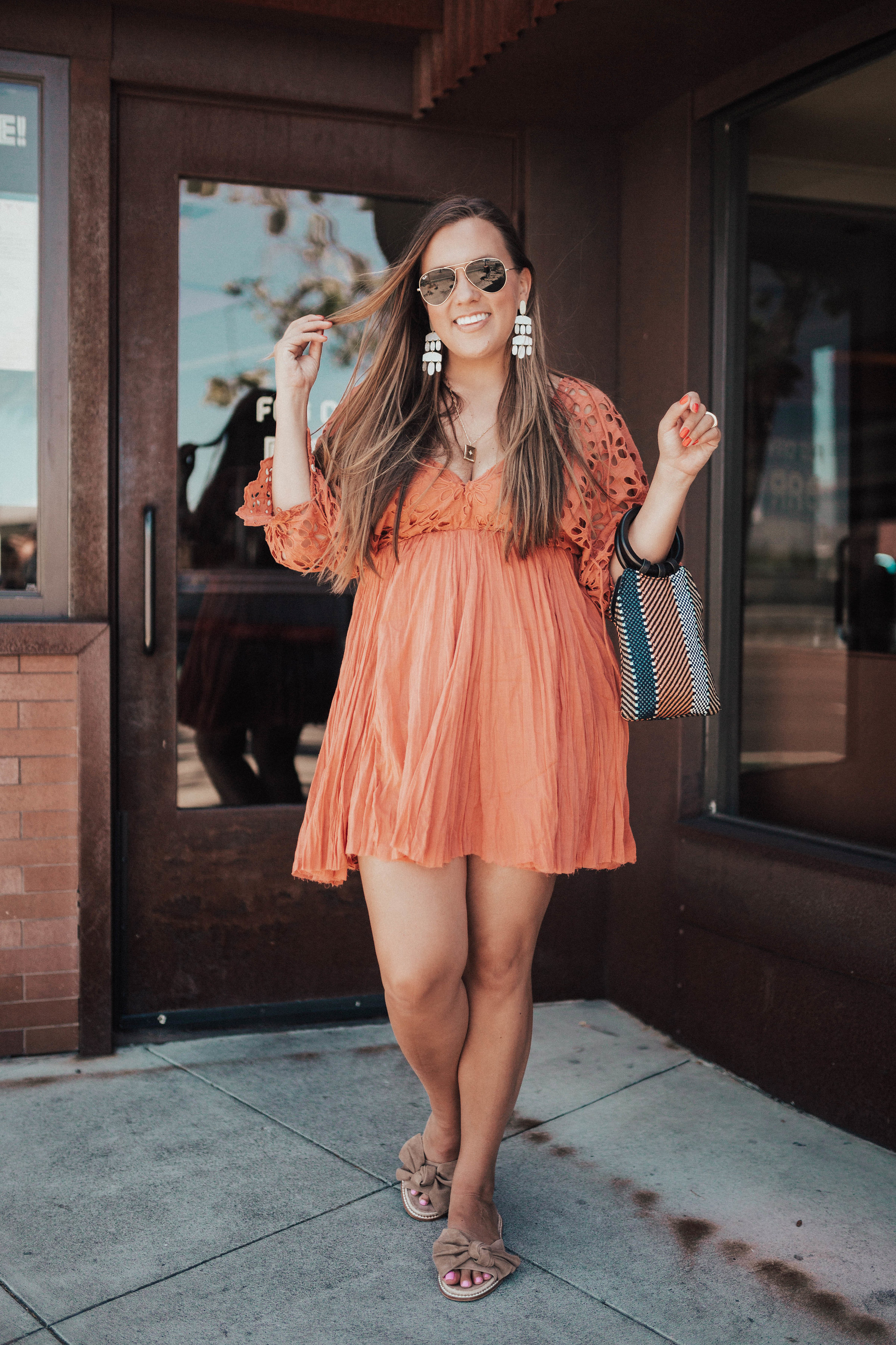 Ashley Zeal from Two Peas in a Prada wears the Bella Note Minidress by Free People. The dress comes in three colors and is available at Nordstrom. 