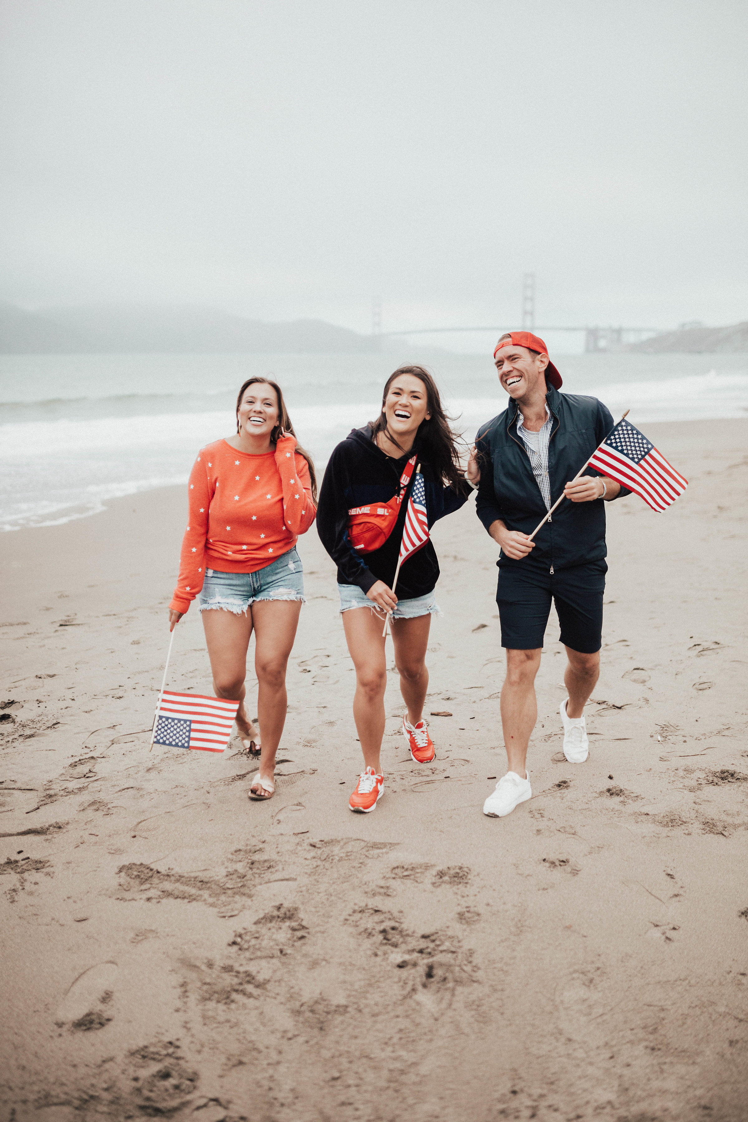 Ashley Zeal from Two Peas in a Prada shares her 4th of July lookbook featuring some red white and blue favorites. She is wearing an Aerie swimsuit and a Wildfox sweatshirt. 