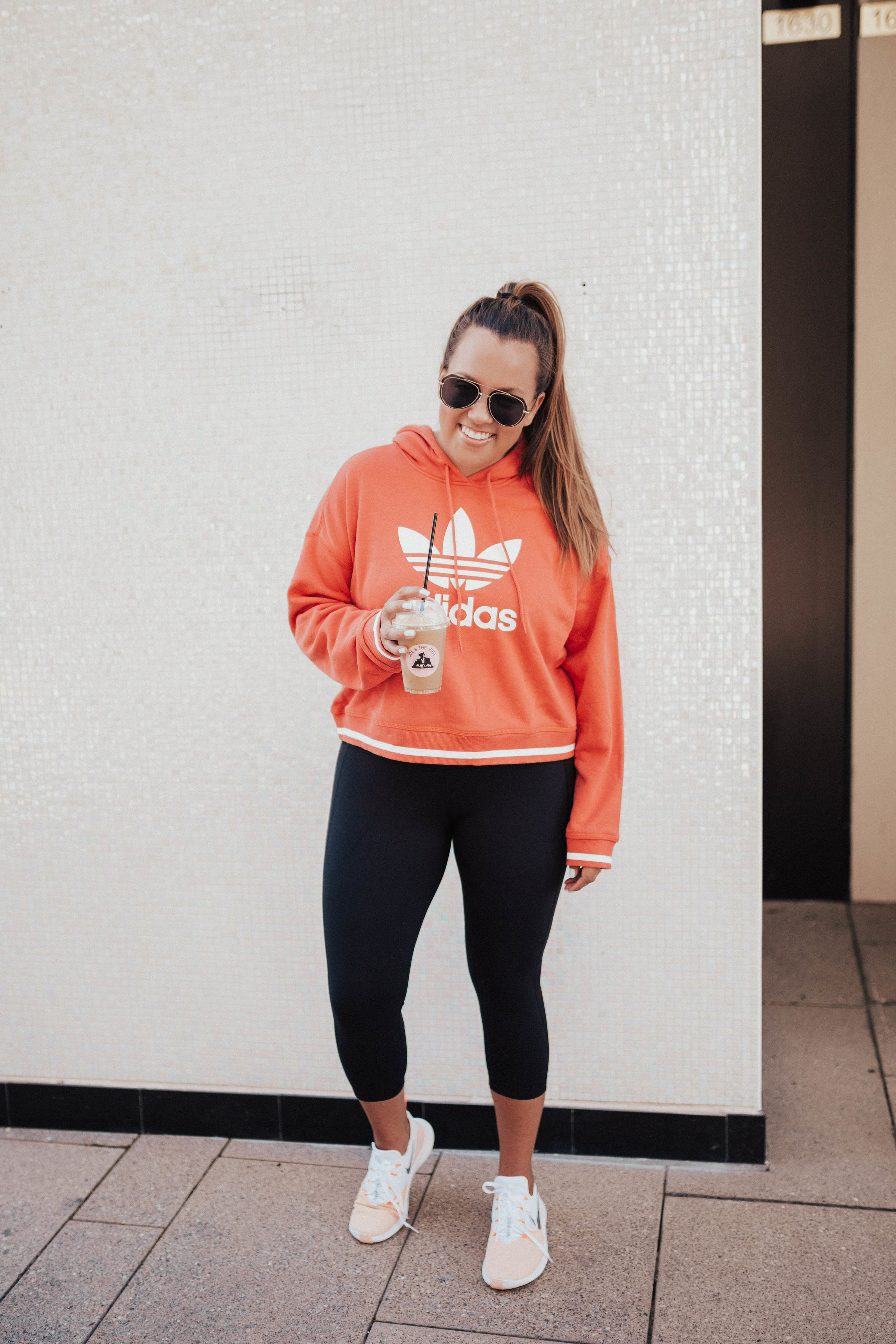 Ashley Zeal from Two Peas in a Prada shares the best activewear on sale at Nordstrom. She is wearing Nike, Adidas and Zella. 