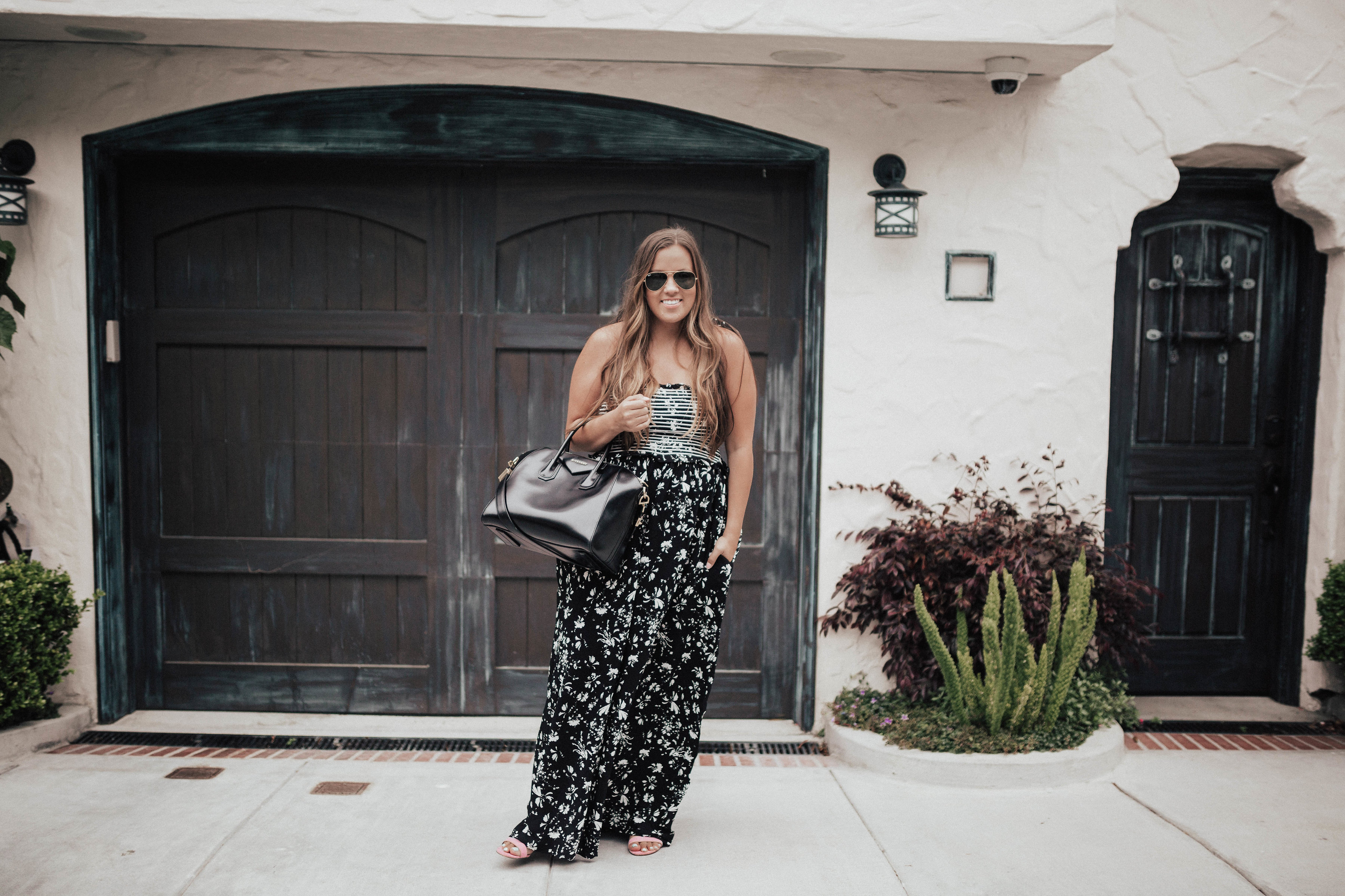 Ashley Zeal from Two Peas in a Prada shares her favorite pieces from the huge Free People Sale. She is wearing the Color My World Wide-Leg Jumpsuit. 