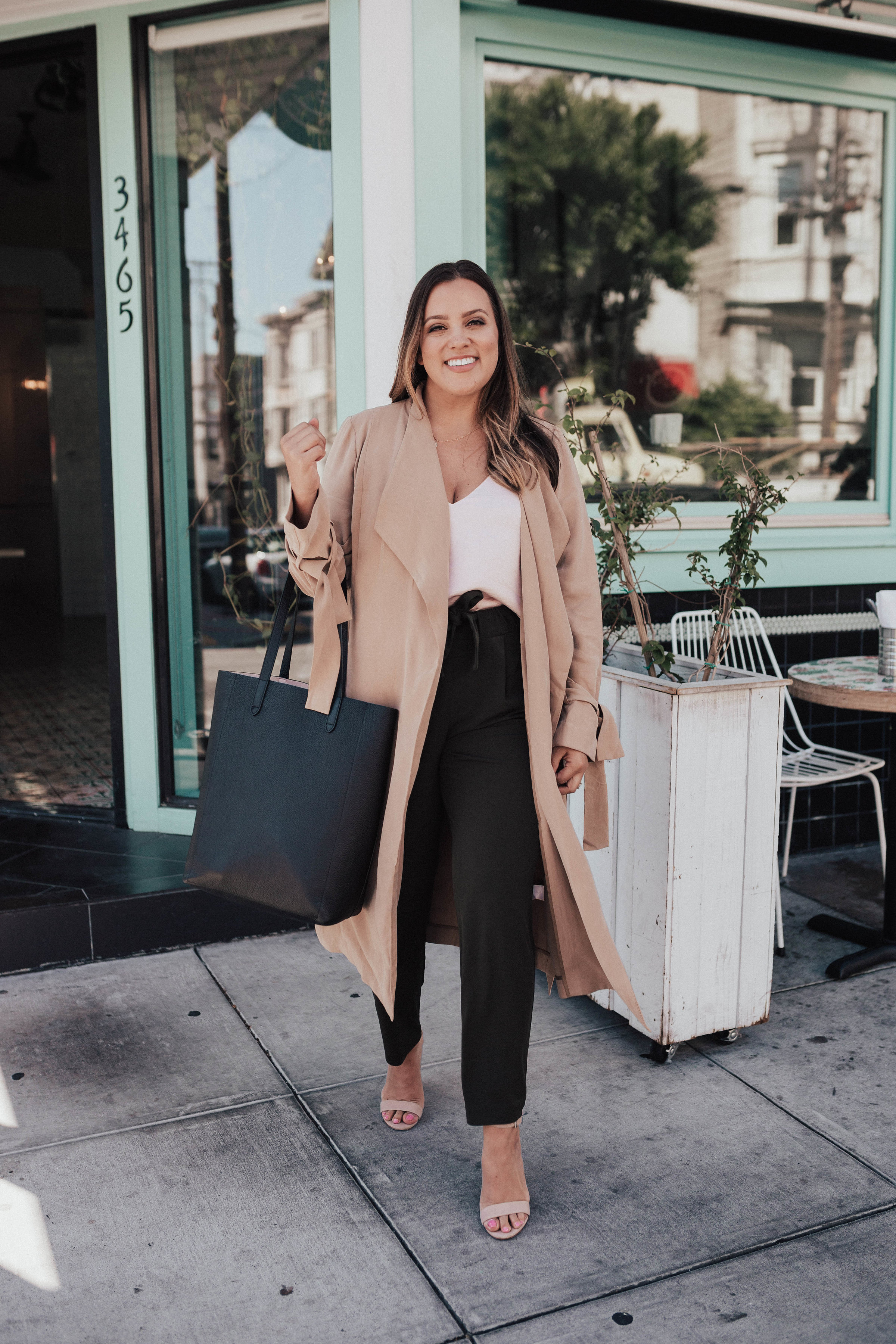 Ashley Zeal from Two Peas in a Prada partners with Express to share a fun Wear to Work outfit. She is wearing Express joggers, cami and trench. 