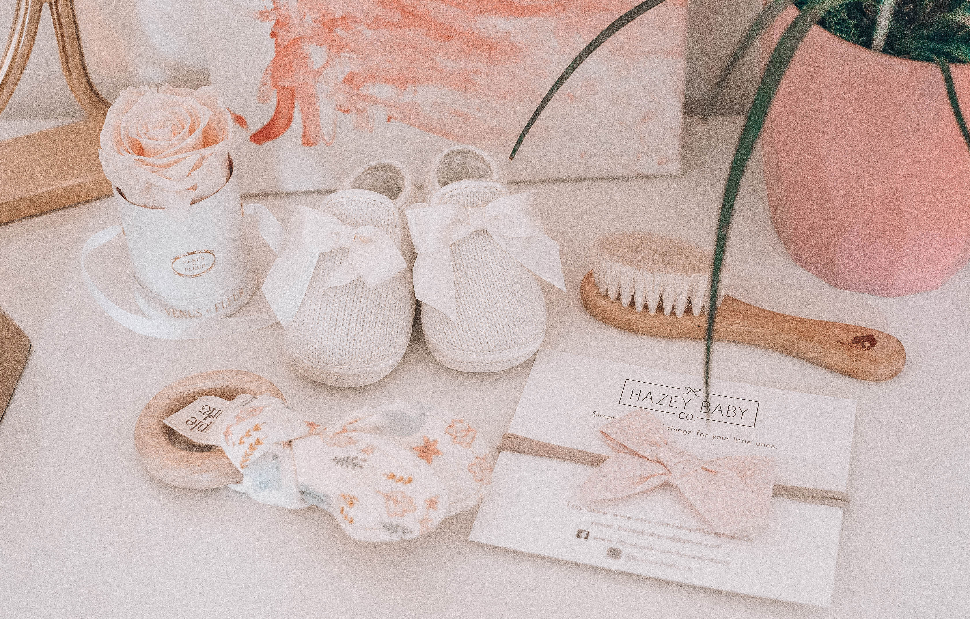 Emily Farren Wieczorek of Two Peas in a Prada shares baby Caroline's nursery - it is a modern baby nursery with pinks, golds and lots of natural greenery. 