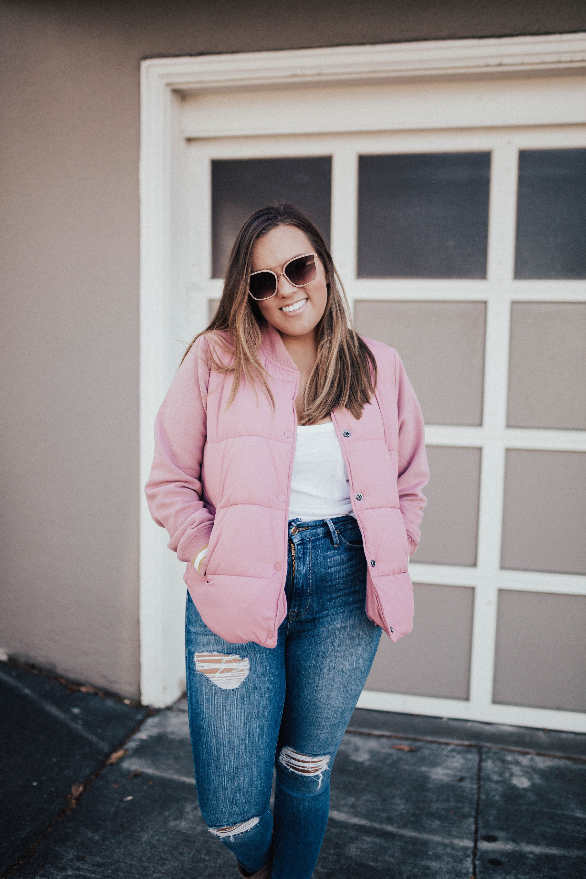 Ashley Zeal from Two Peas in a Prada shares the perfect puffer. She is wearing a pink puffer jacket from Abercrombie & Fitch. 