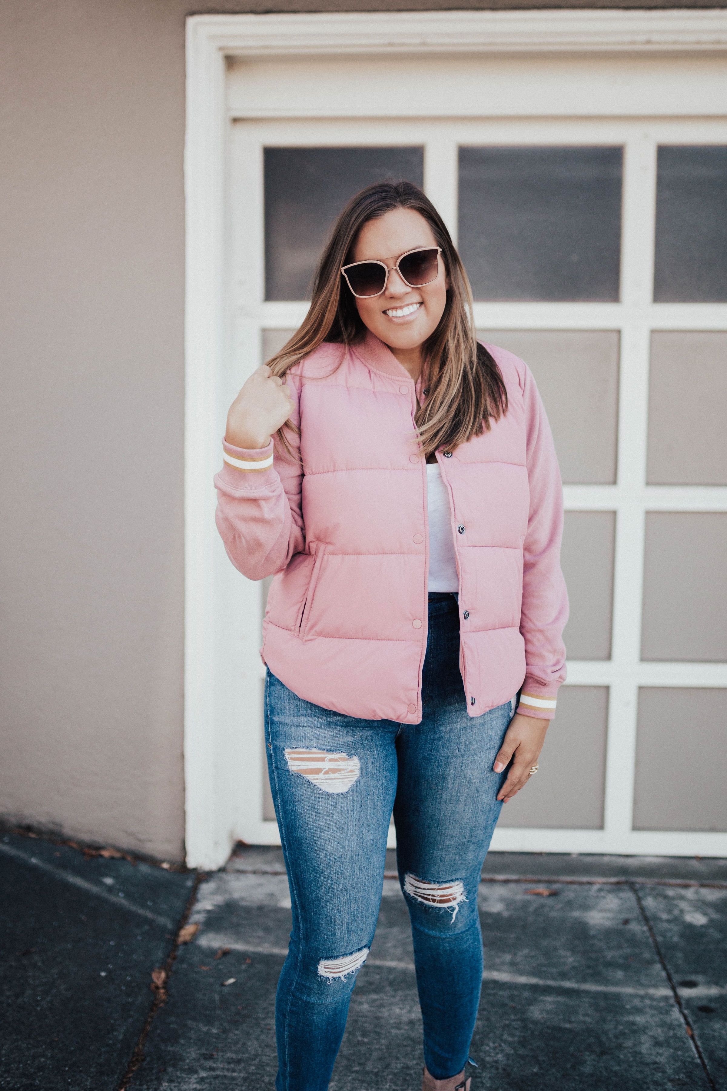 Ashley Zeal from Two Peas in a Prada shares the perfect puffer. She is wearing a pink puffer jacket from Abercrombie & Fitch. 