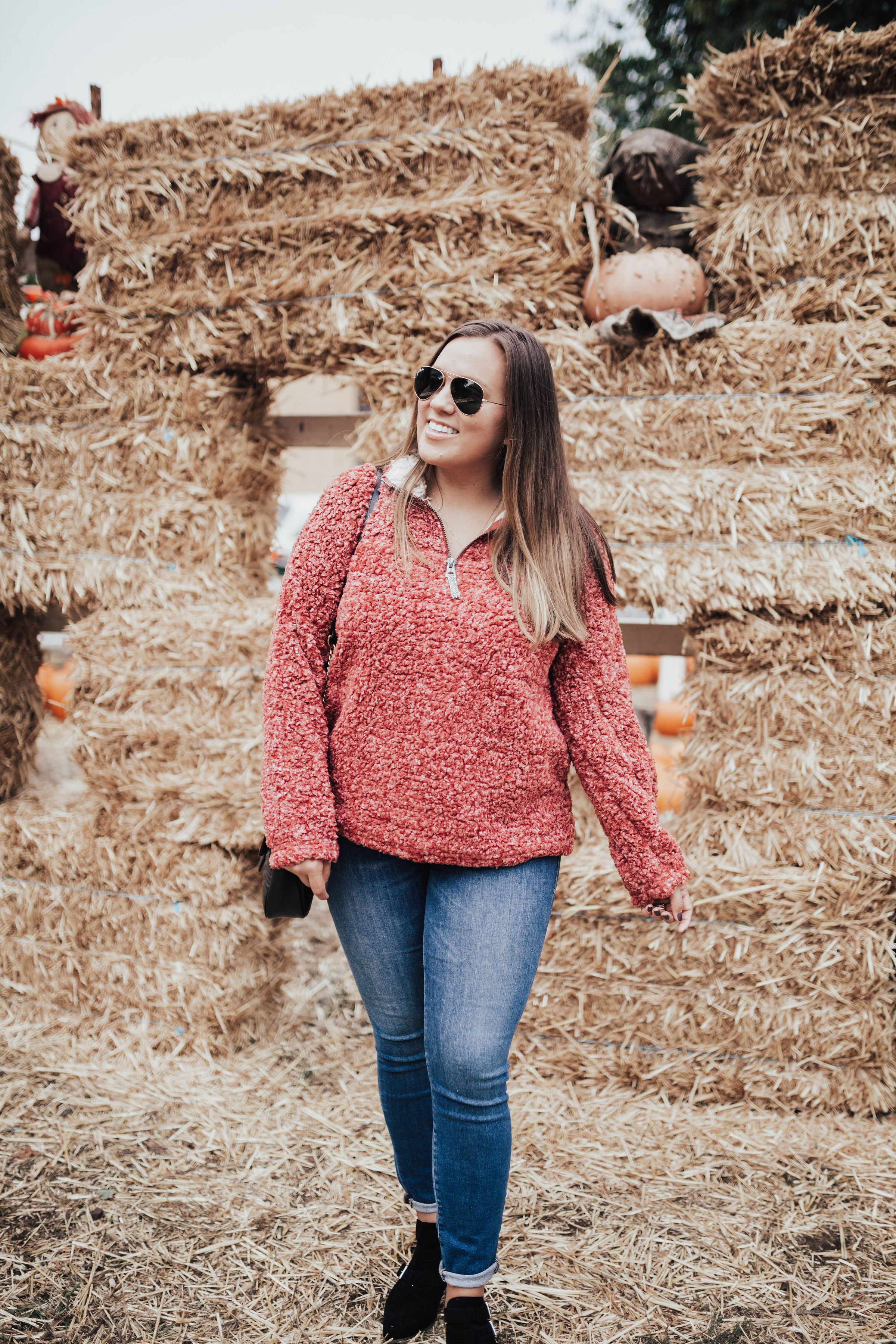 Ashley Zeal from Two Peas in a Prada shares her fall bucket list. She is wearing a Dylan by True Grit stadium pullover from Zappos. 