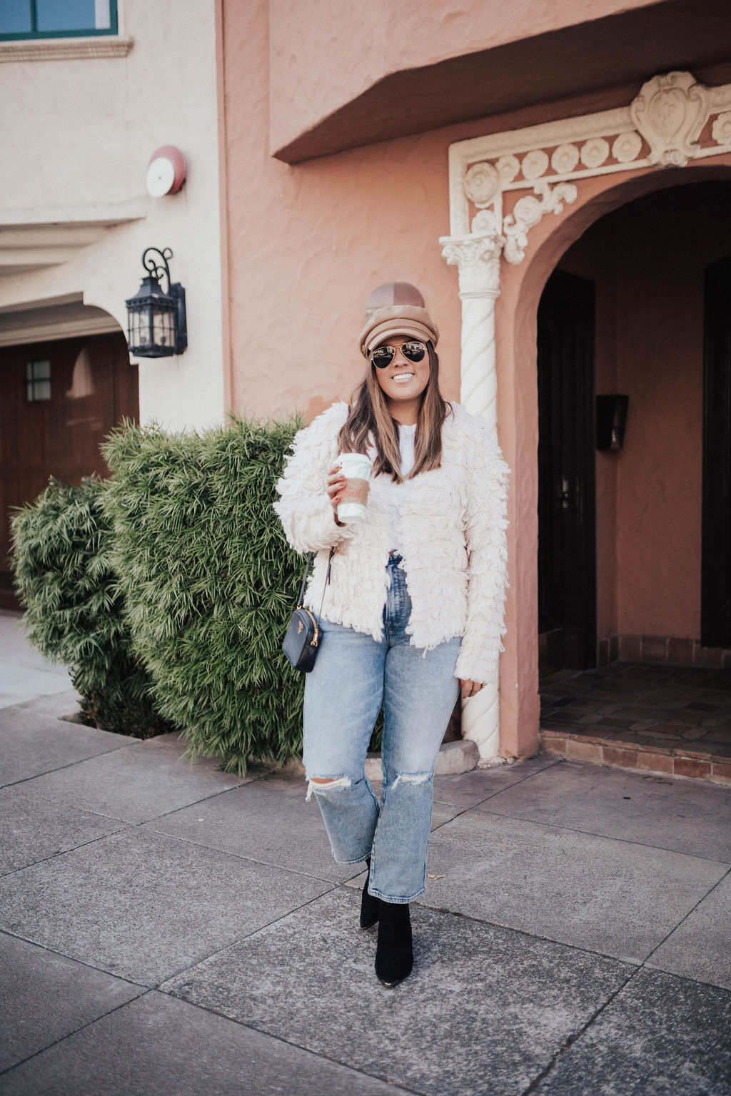 San Francisco blogger Ashley Zeal from Two Peas in a Prada shares a shaggy open cardigan from Nordstrom. It's available in two colors, and in stock in all sizes. 