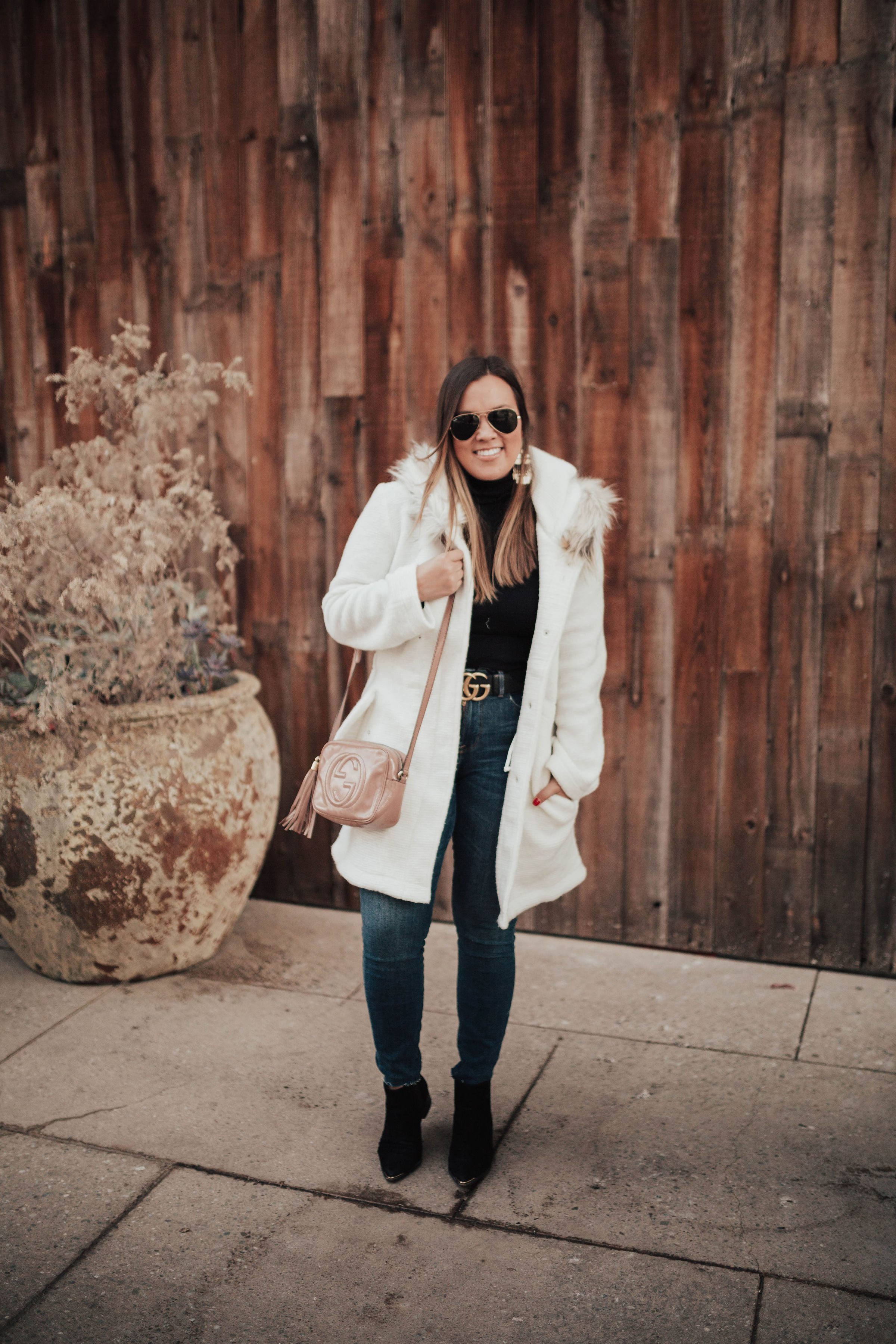 San Francisco blogger, Ashley Zeal, from Two Peas in a Prada shares what she is packing for Seattle. Featuring lots of turtlenecks, sweaters and jackets!