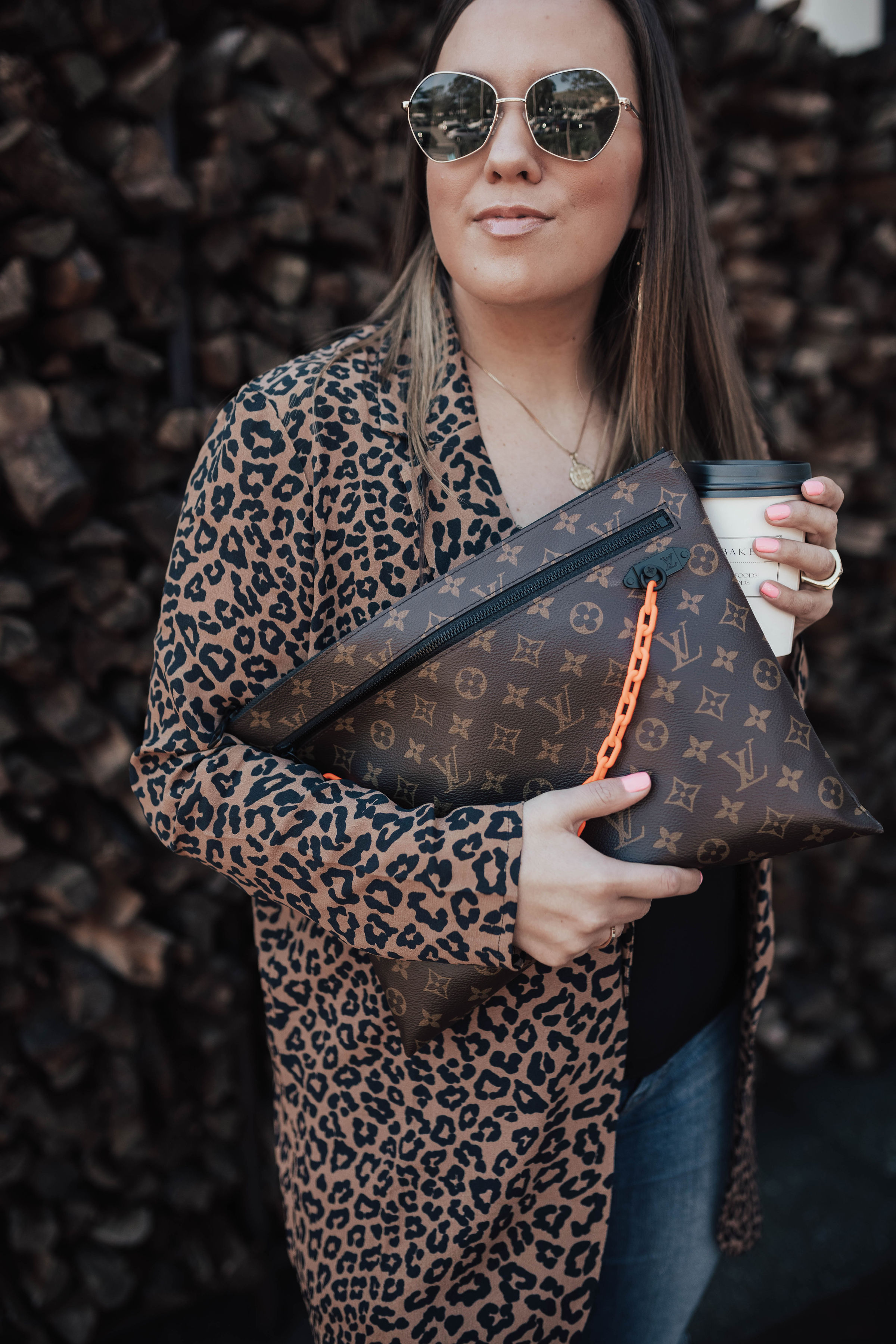 San Francisco blogger, Ashley Zeal, from Two Peas in a Prada shares how to get Spring's Most Wanted items on eBay. She is wearing the Louis Vuitton A4 Pouch. 