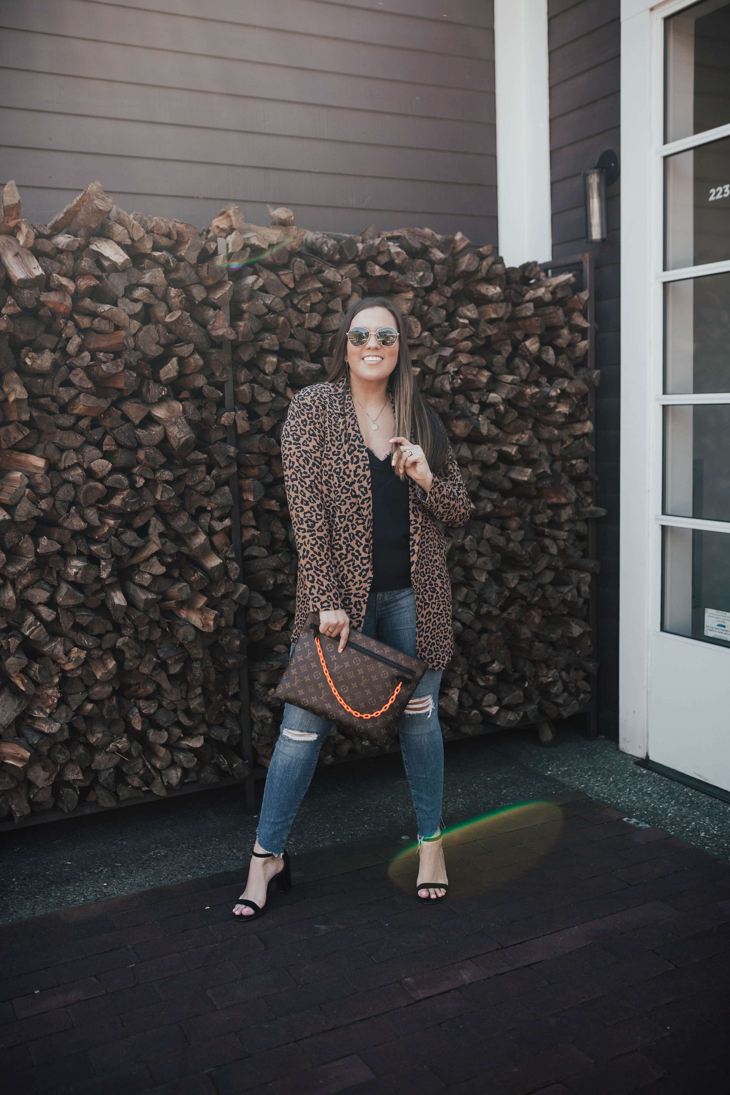 San Francisco blogger, Ashley Zeal, from Two Peas in a Prada shares how to get Spring's Most Wanted items on eBay. She is wearing the Louis Vuitton A4 Pouch. 