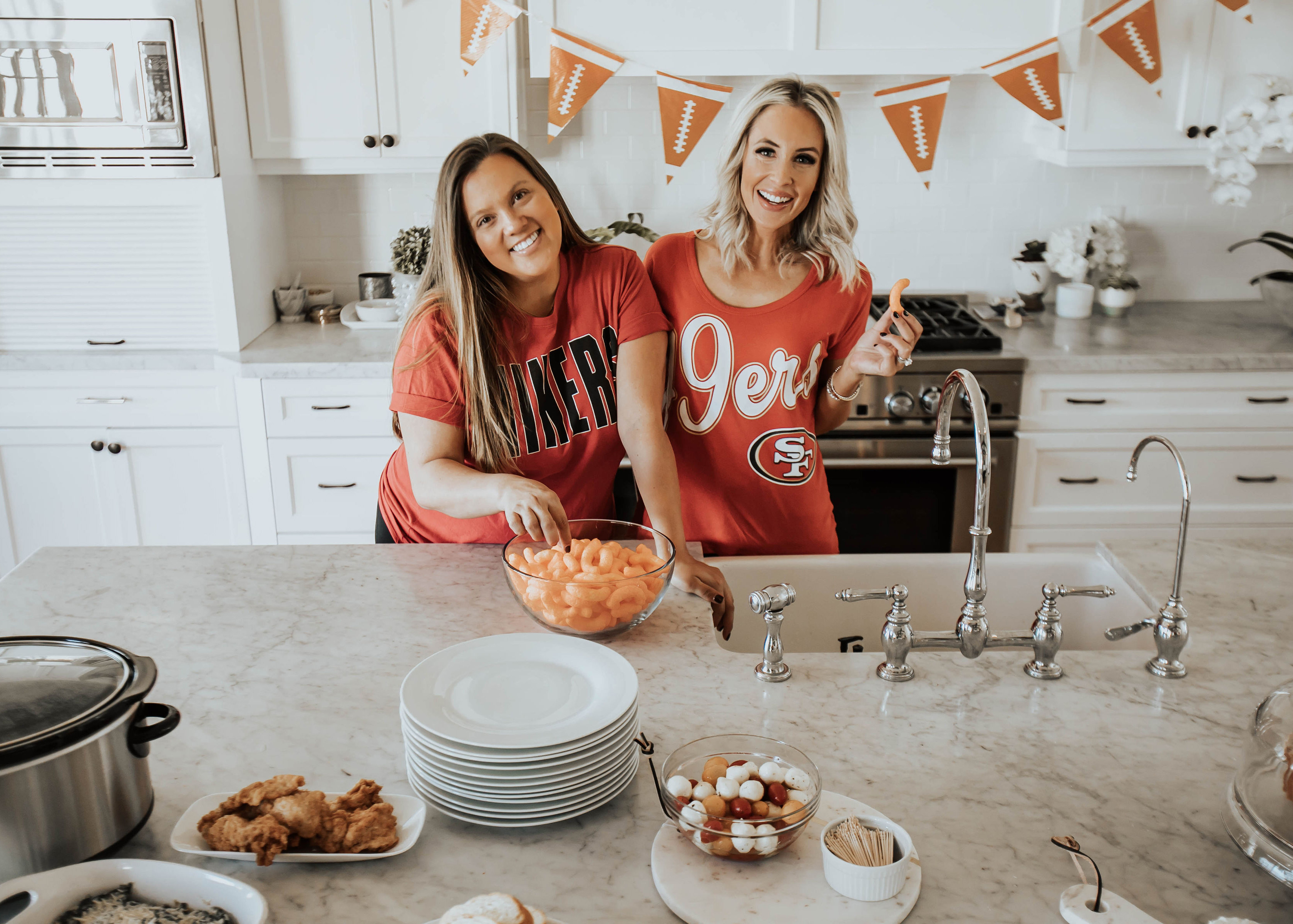 Two Peas in a Prada Bloggers, Emily Farren Wieczorek and Ashley Zeal share their favorite Super Bowl snack - this amazing healthy Spinach Artichoke Dip