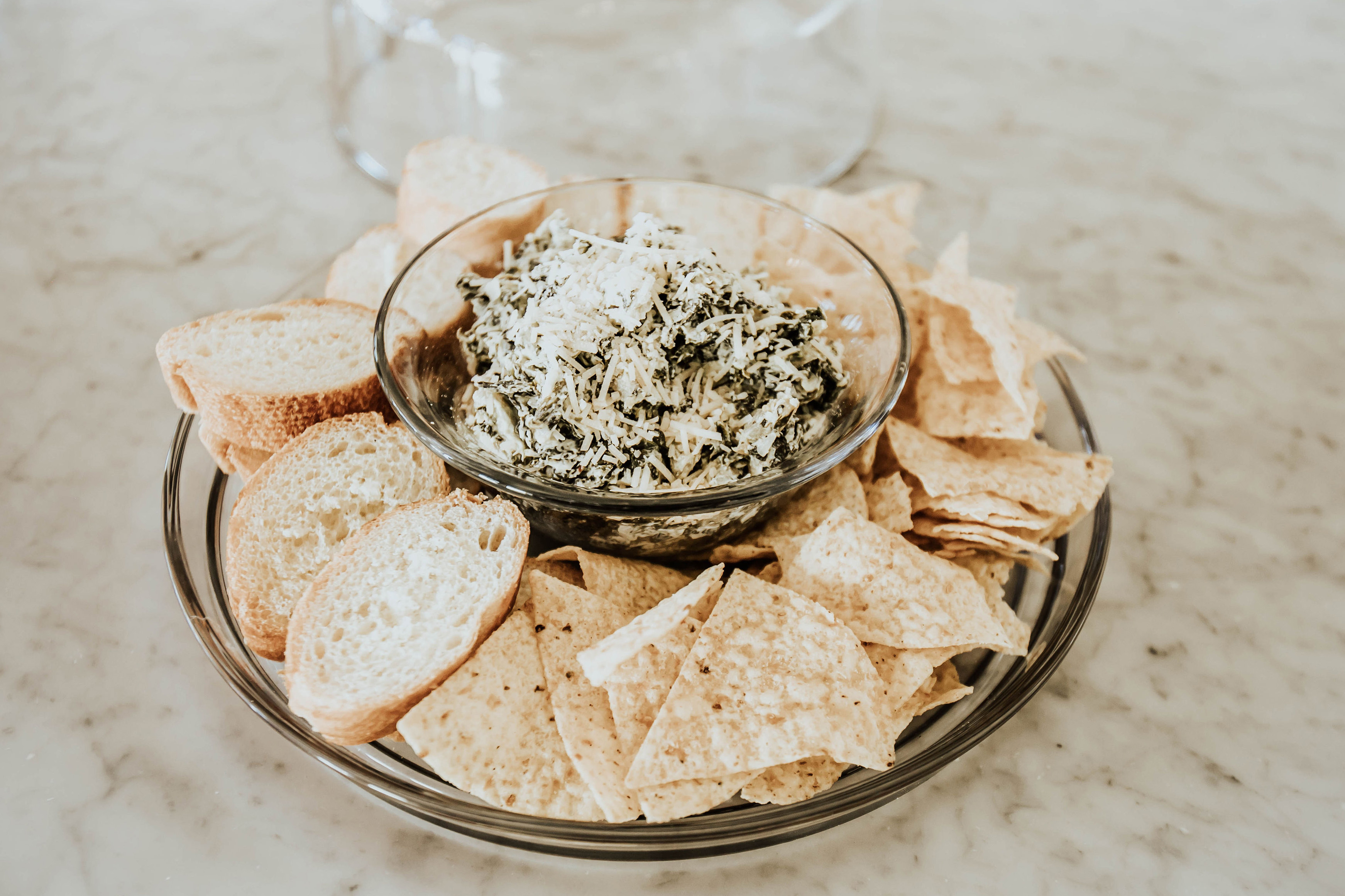 Emily Farren Wieczorek and Ashley Zeal of two peas in a prada share their game day rituals and Emily shares her recipe for Healthy Spinach Artichoke Dip
