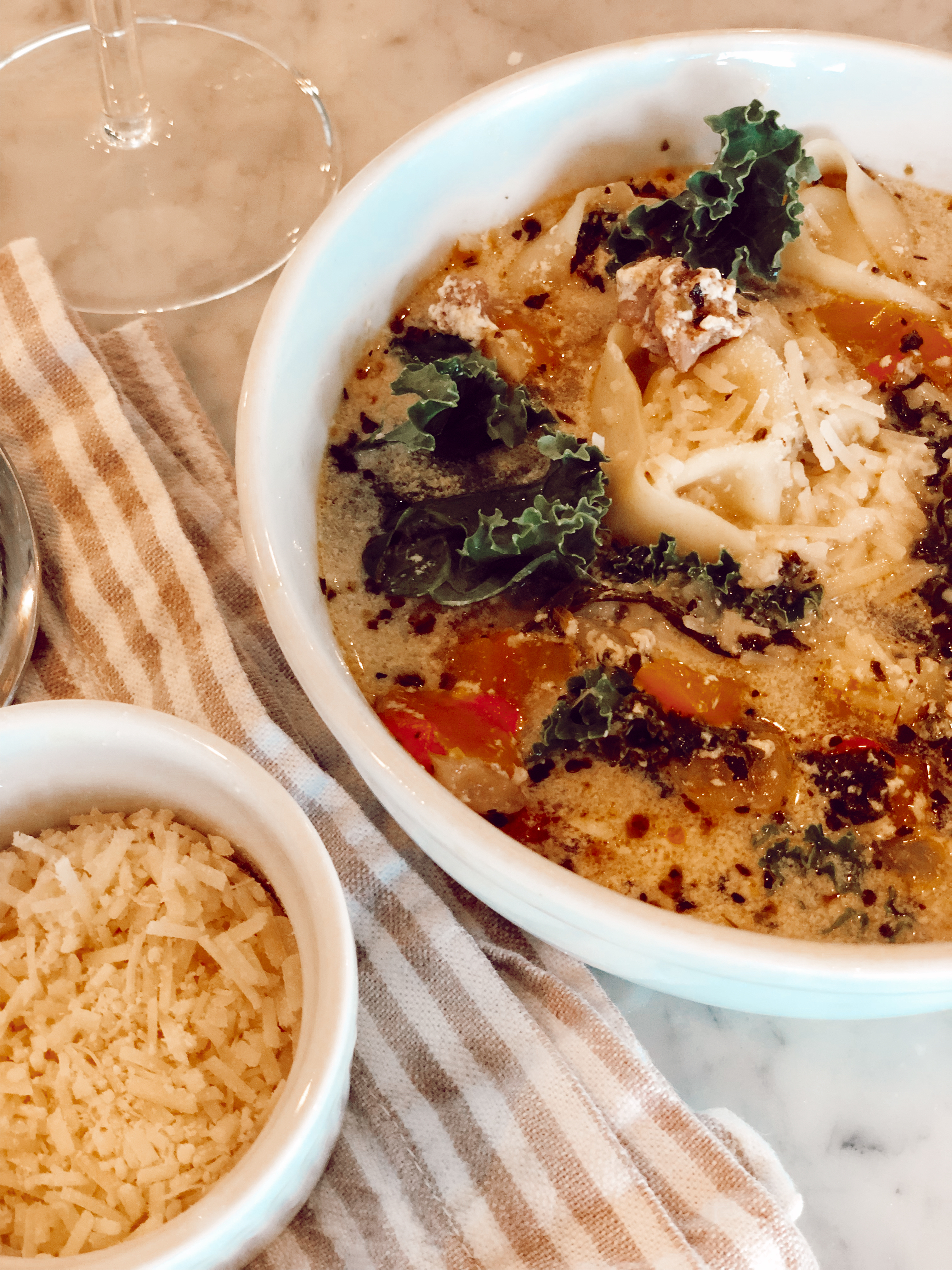 Emily Farren Wieczorek of the fashion and lifestyle blog Two Peas in a Prada shares her new crock pot recipe - Tortellini Toscana Crock Pot Soup