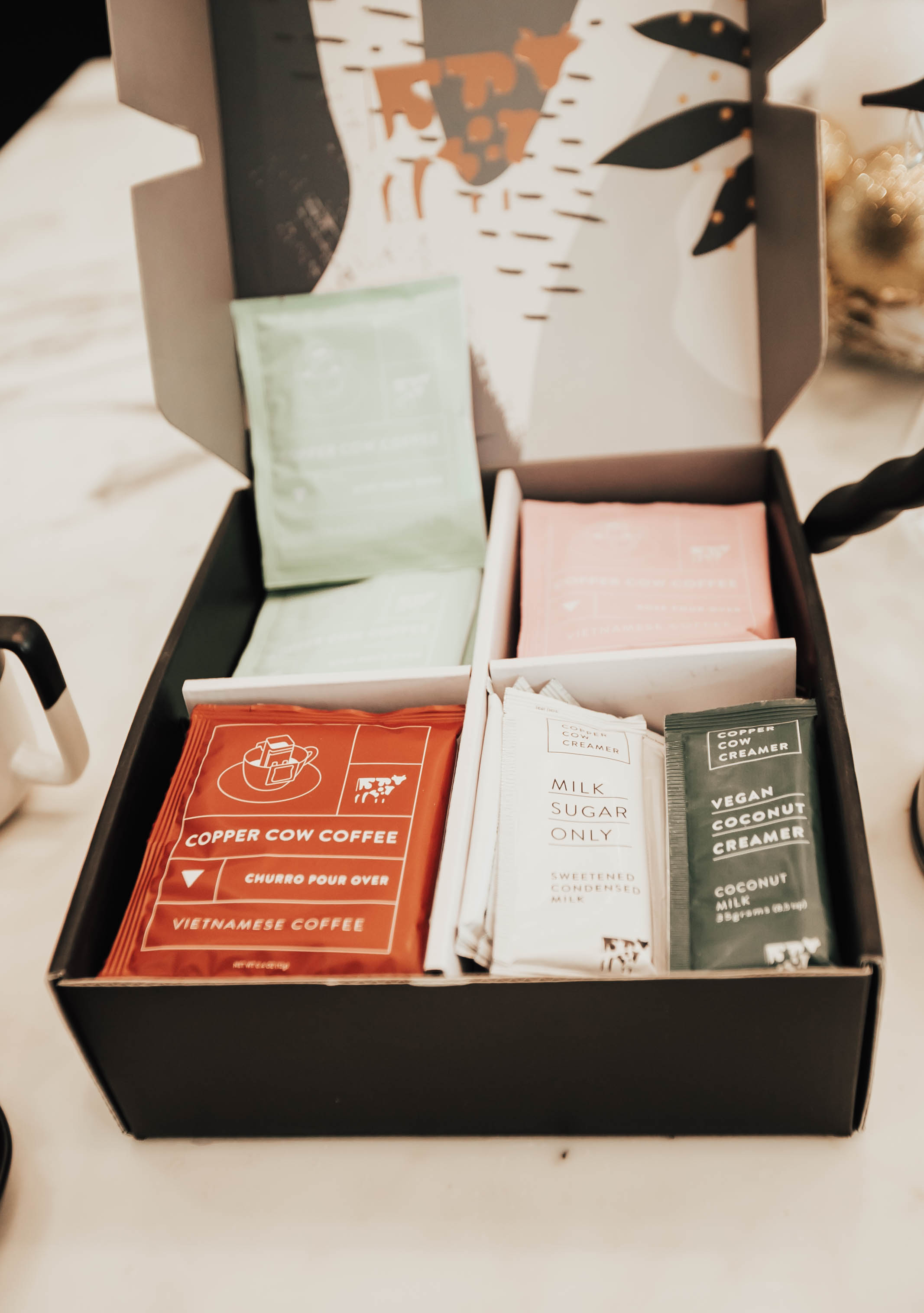 Two Peas in a Prada co-founder Emily Farren Wieczorek shares the best gift idea for the cool person on your list - Copper Cow Coffee !