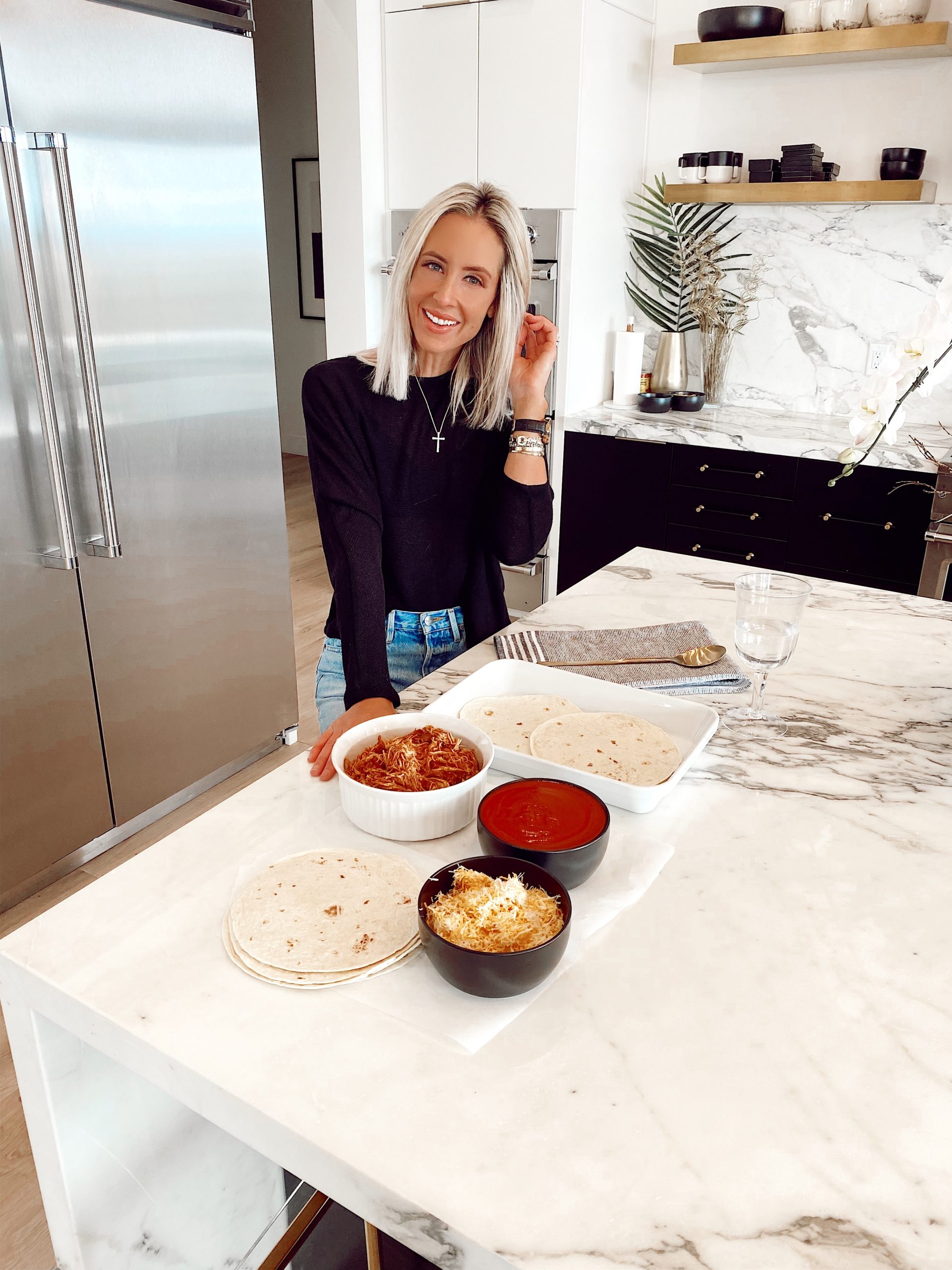 Two Peas in a Prada co founder, Emily Farren Wieczorek shares Emily's Easy Enchilada Casserole - 5 ingredients, comforting and delicious! 